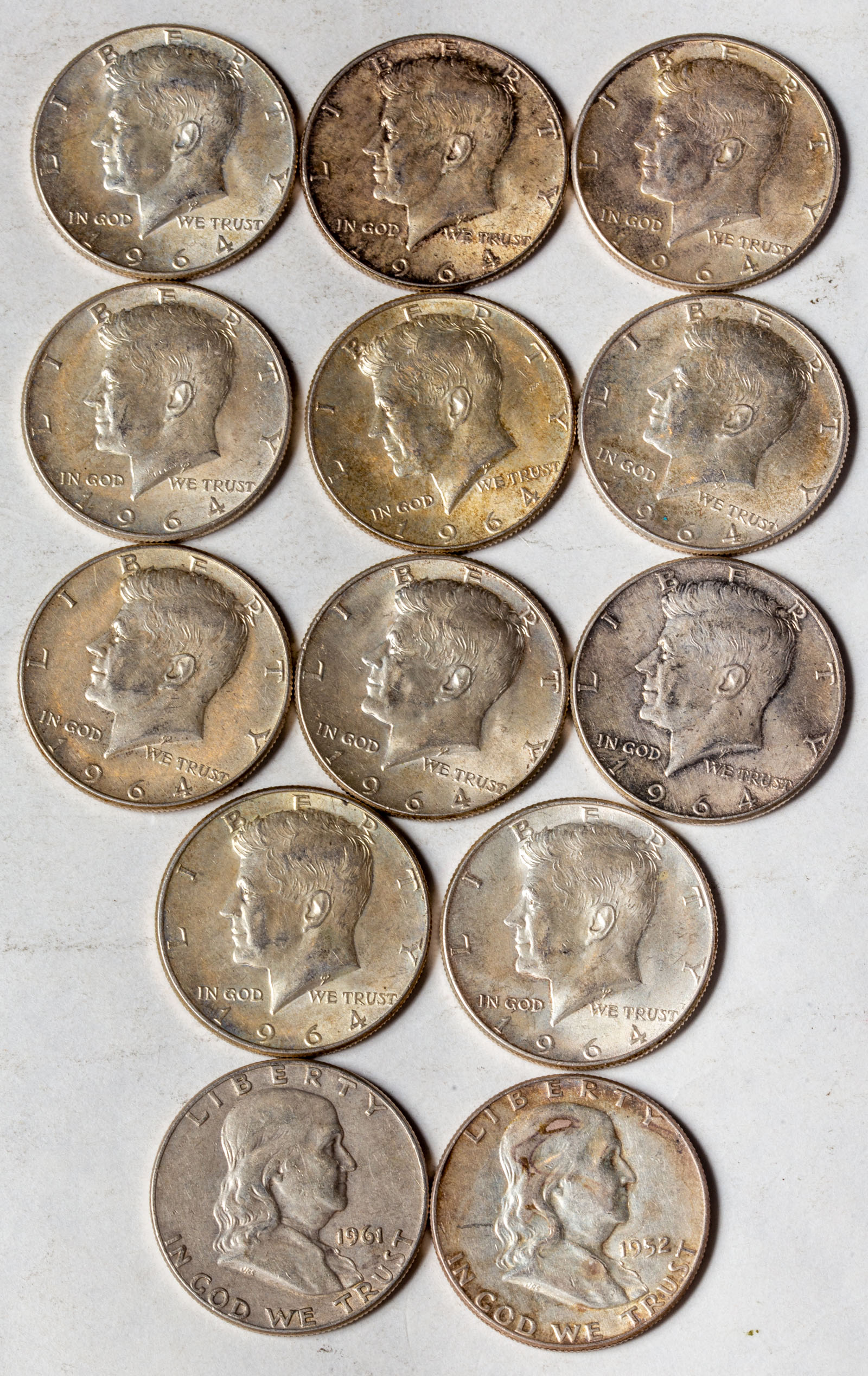 THIRTEEN US 90% SILVER HALF DOLLARS