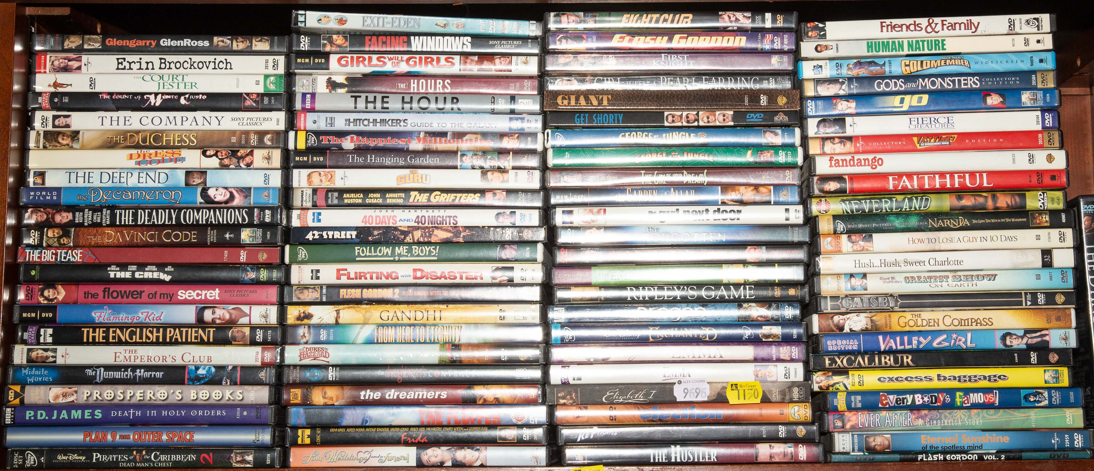 A SHELF OF ASSORTED DVDS Comprising