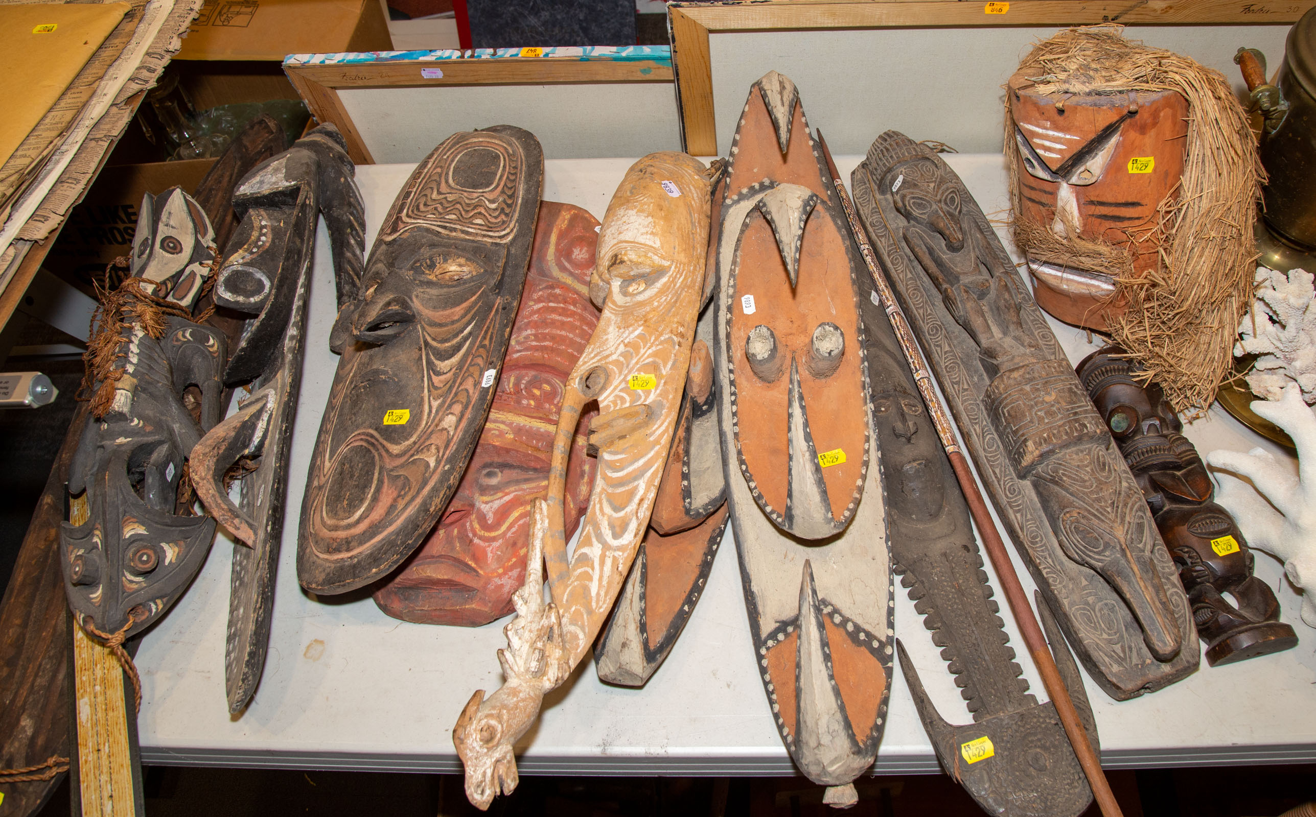 GROUP OF MASKS & FIGURES FROM NEW GUINEA