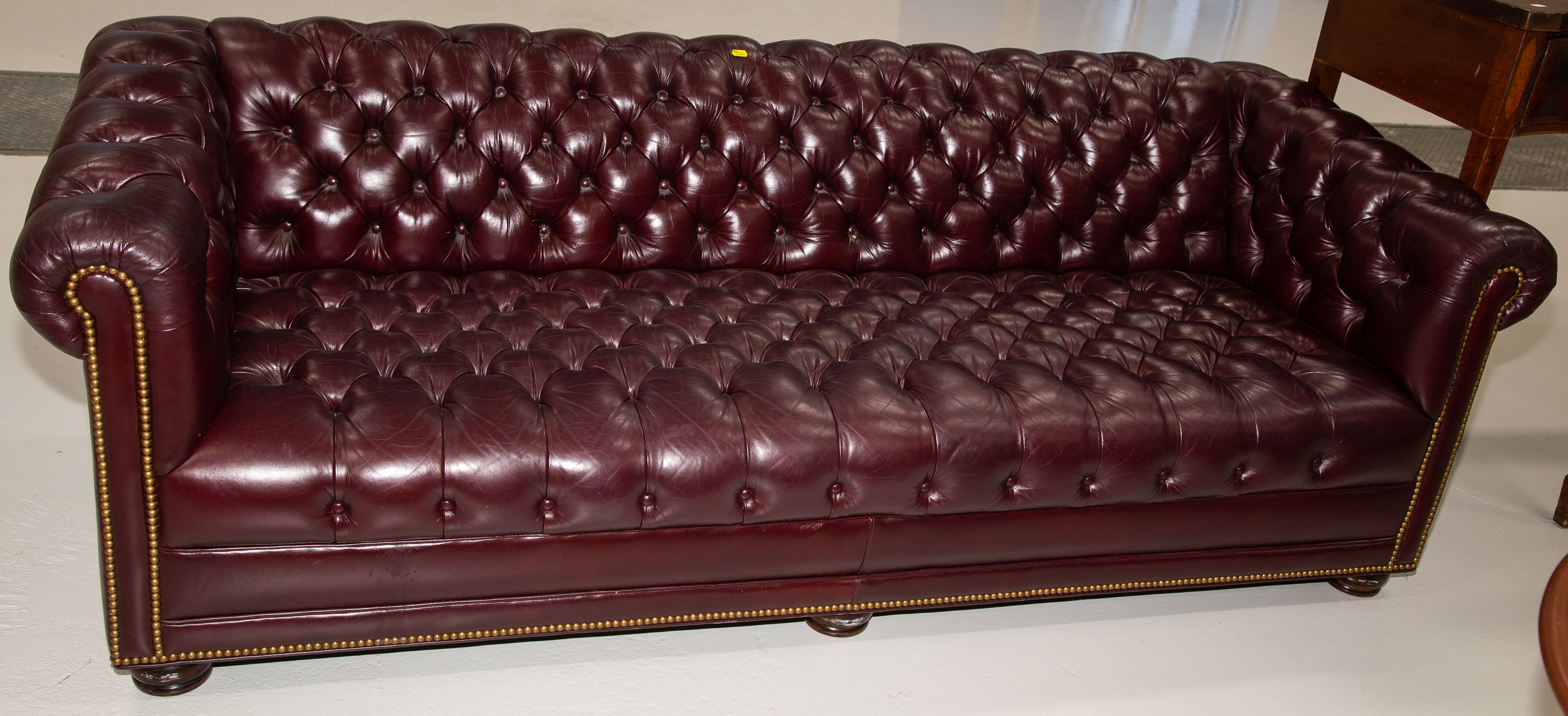 A TUFTED LEATHER SOFA Possibly 3350c6