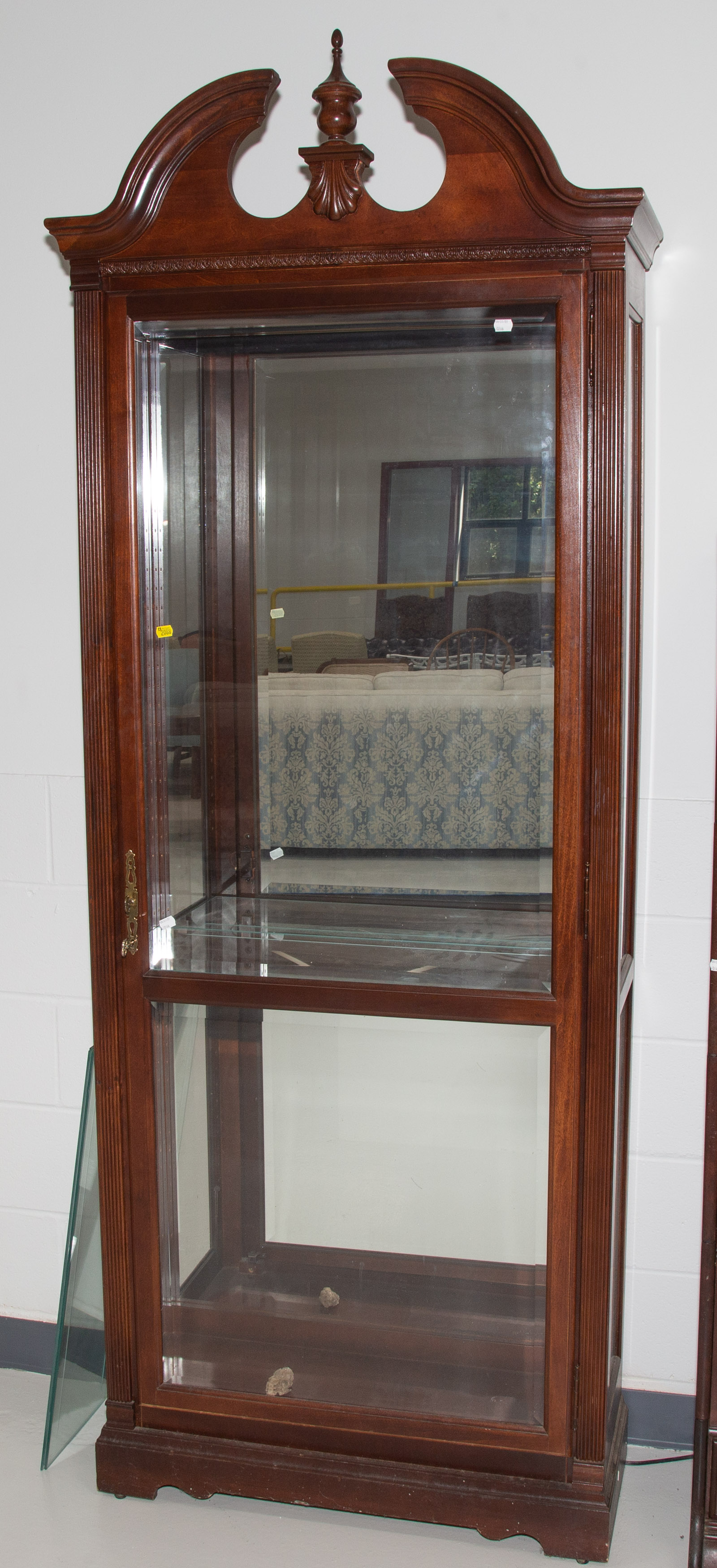 A HOWARD MILLER VITRINE CABINET