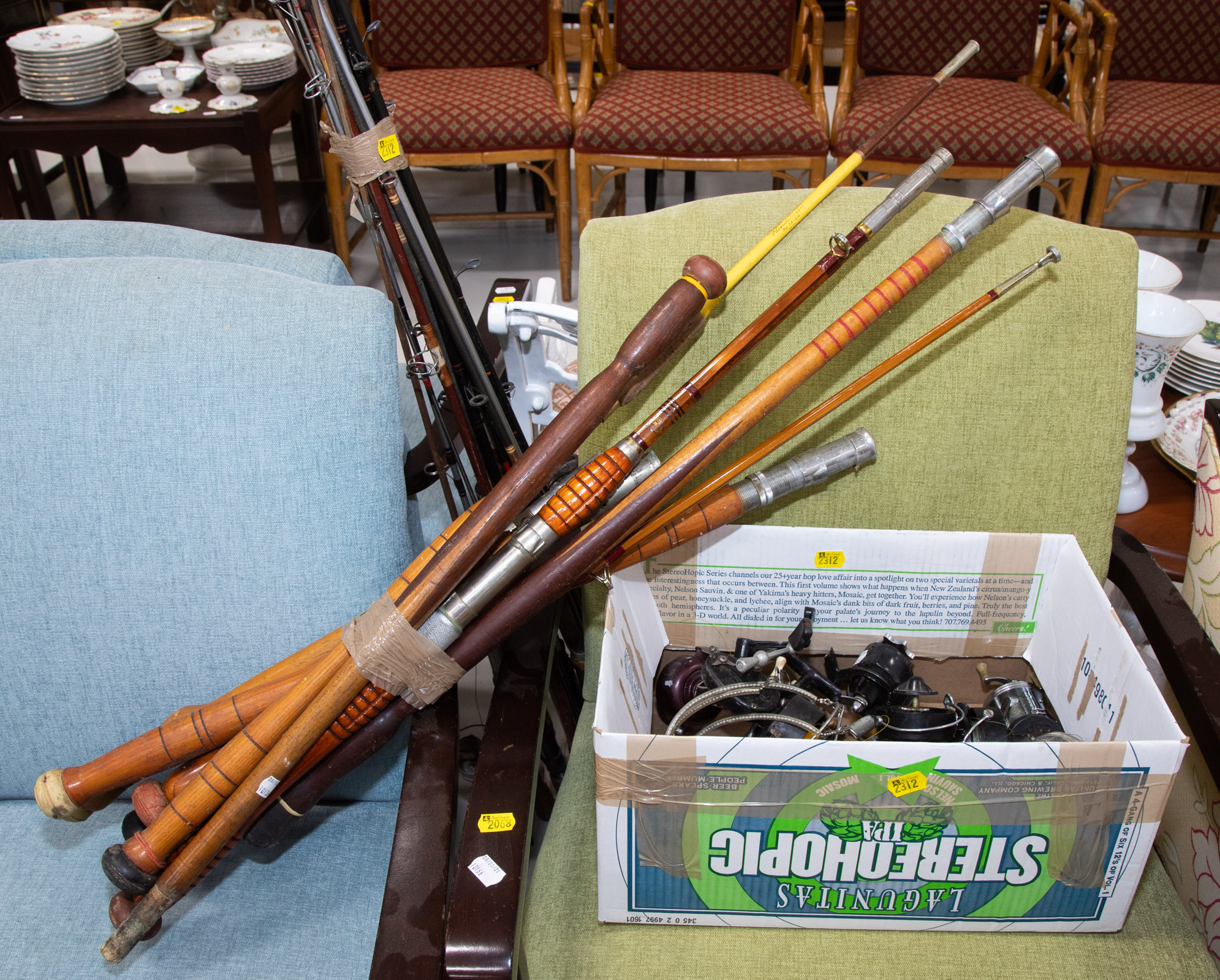 A COLLECTION OF FISHING RODS & REELS