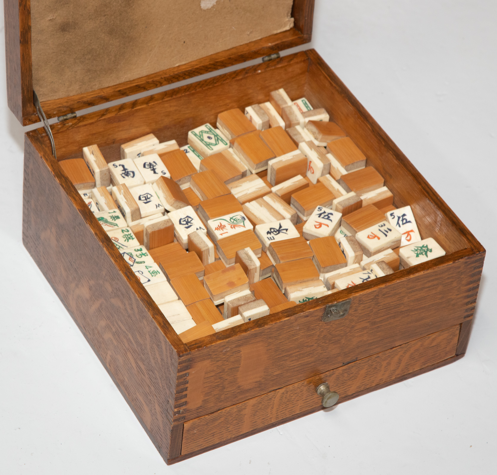 MAHJONG TILES IN OAK CASE .