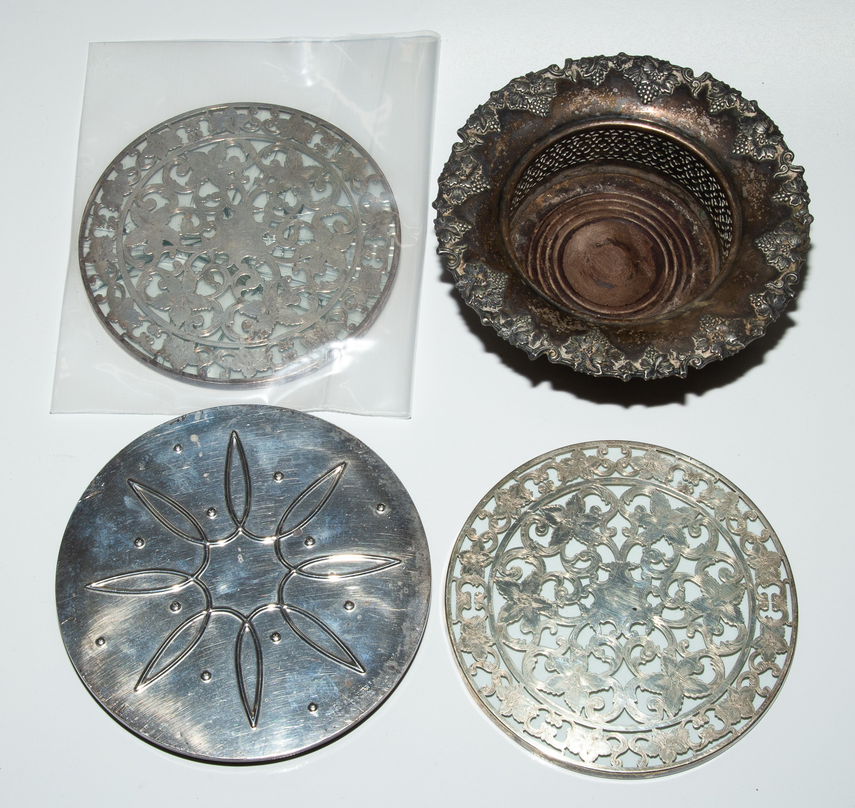 THREE STERLING TRIVETS & SILVER