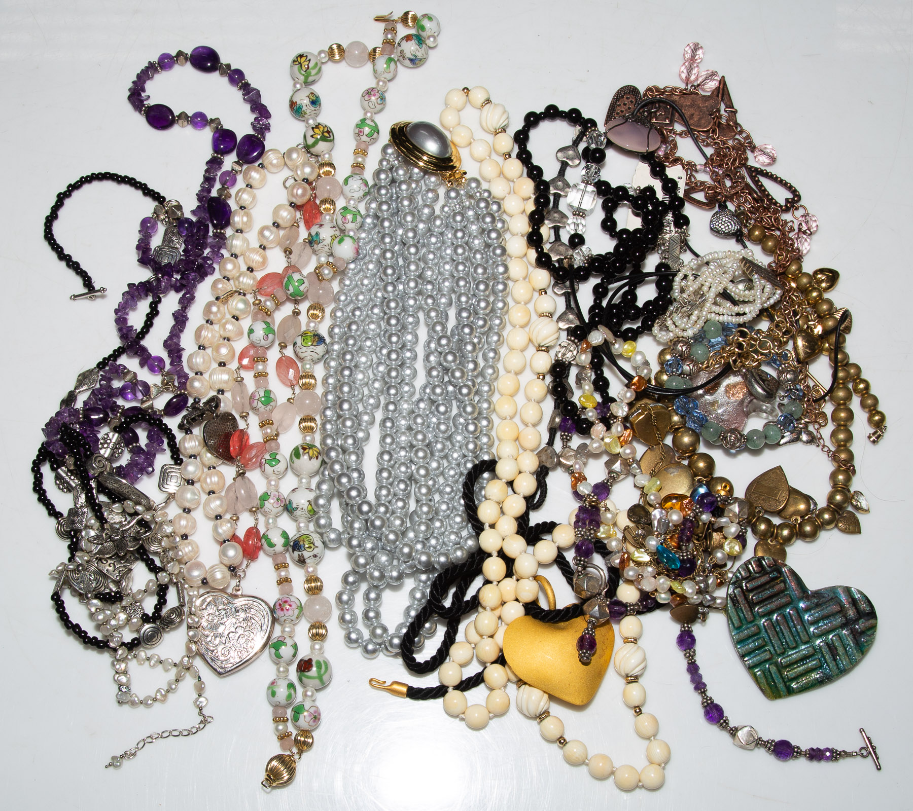 AN ASSORTMENT OF BEADED NECKLACES