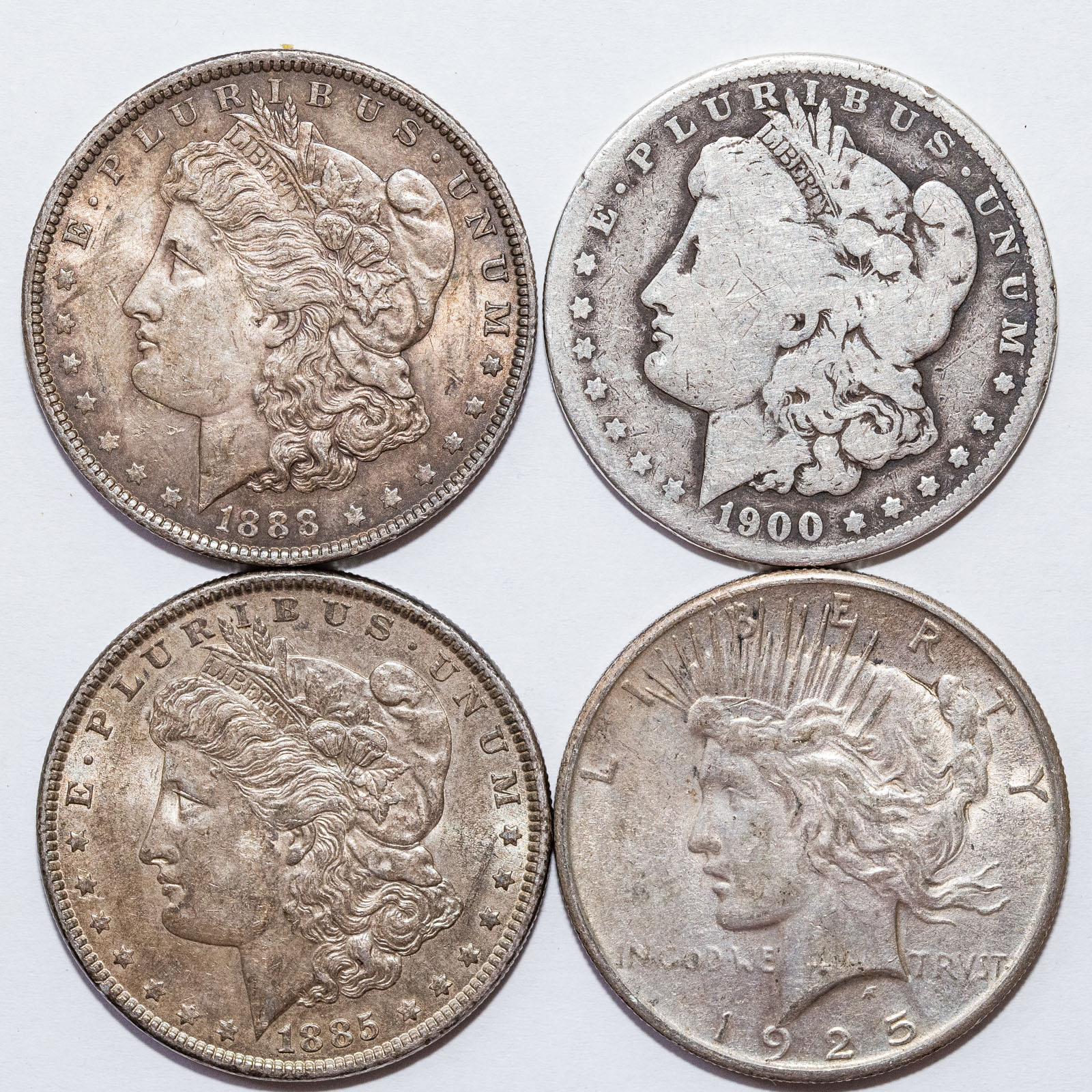 FOUR U.S. SILVER DOLLARS 1885 AU