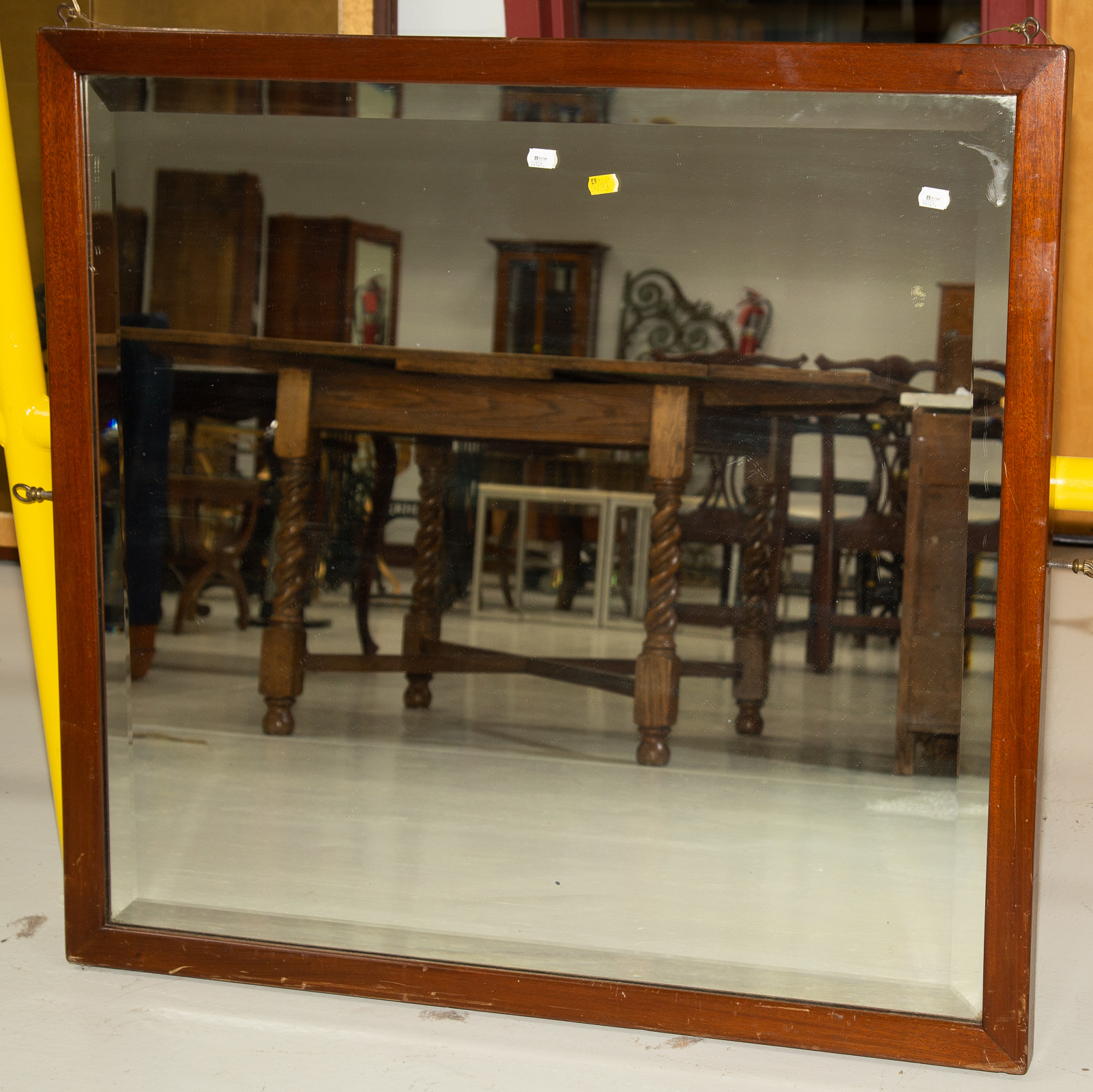 HANGING WALL MIRROR In a mahogany