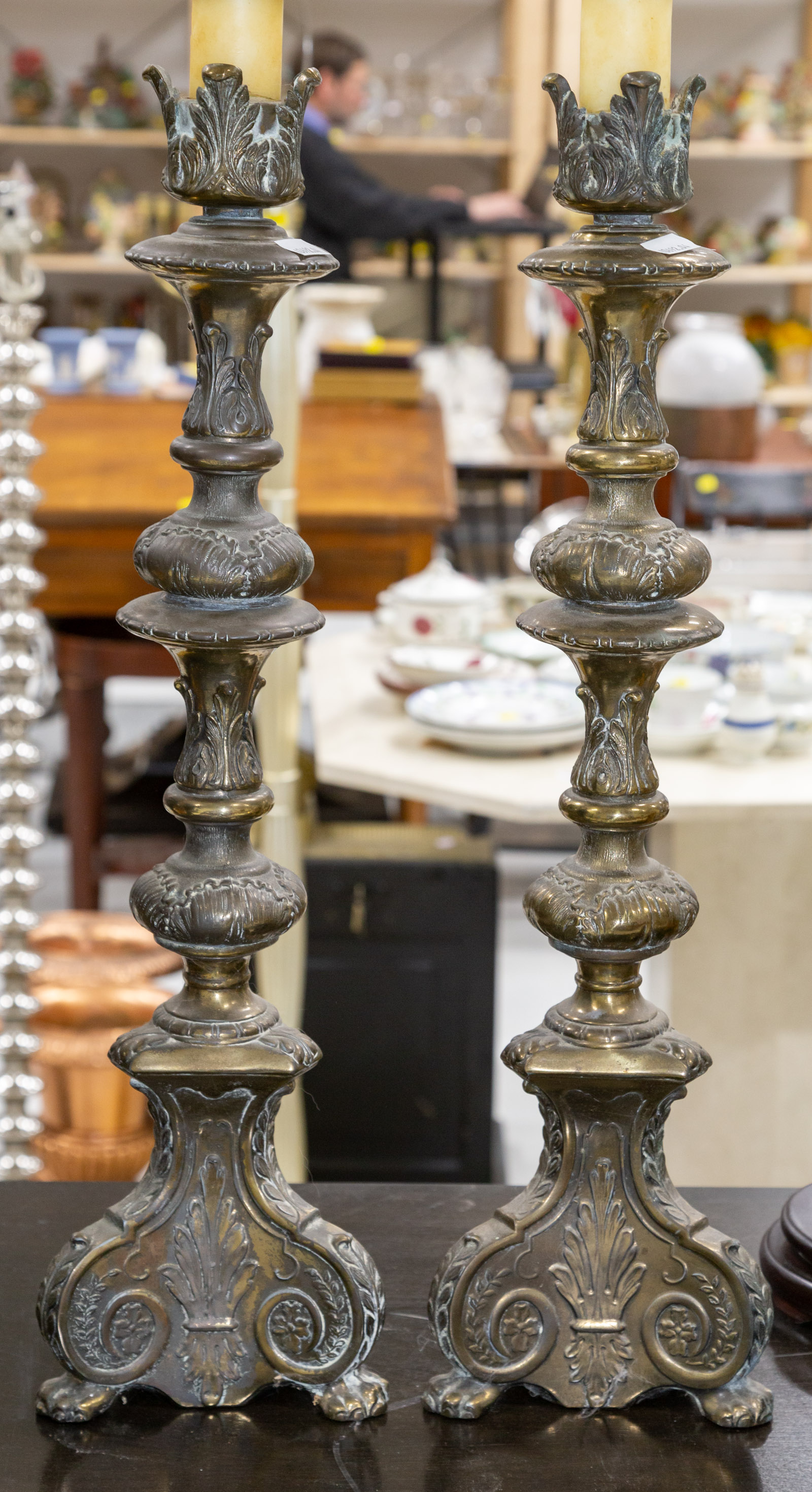 A PAIR OF BAROQUE STYLE CANDLESTICKS
