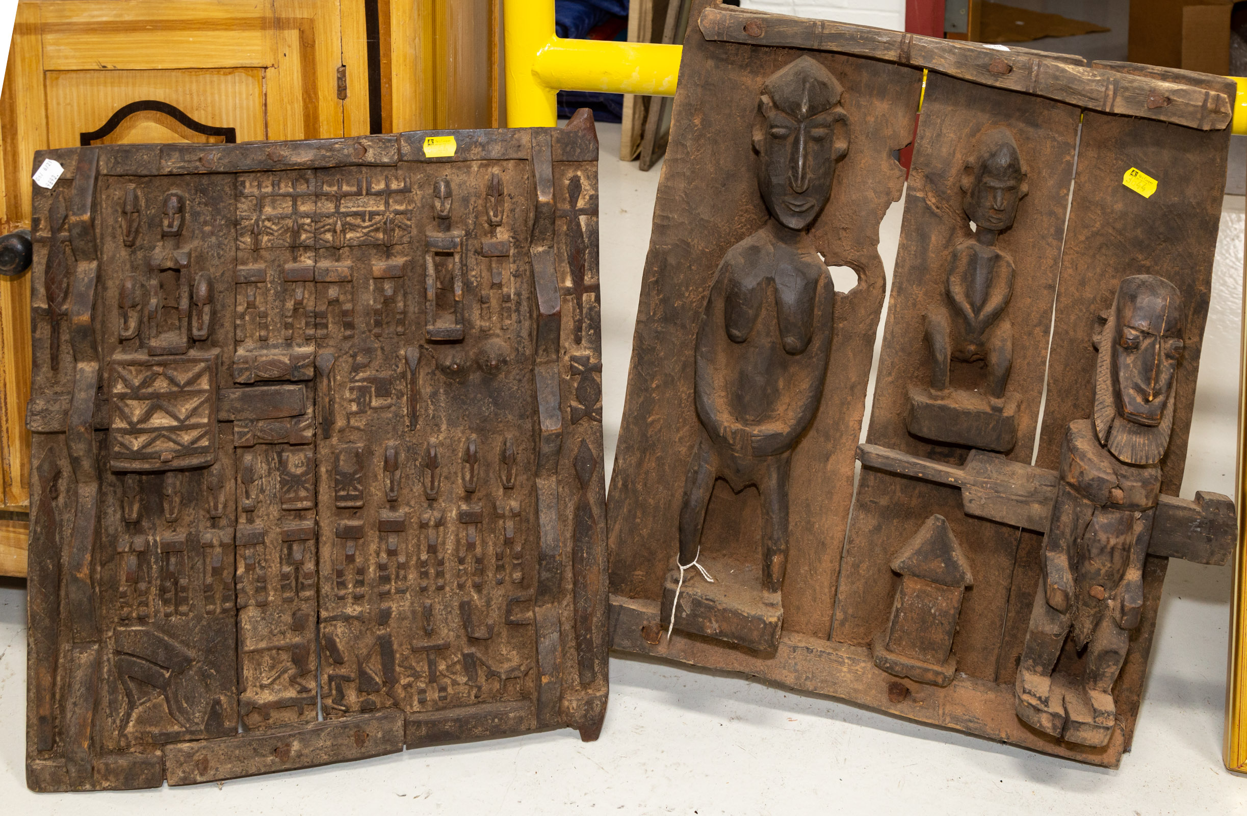 TWO AFRICAN CARVED WOOD GRANARY DOORS