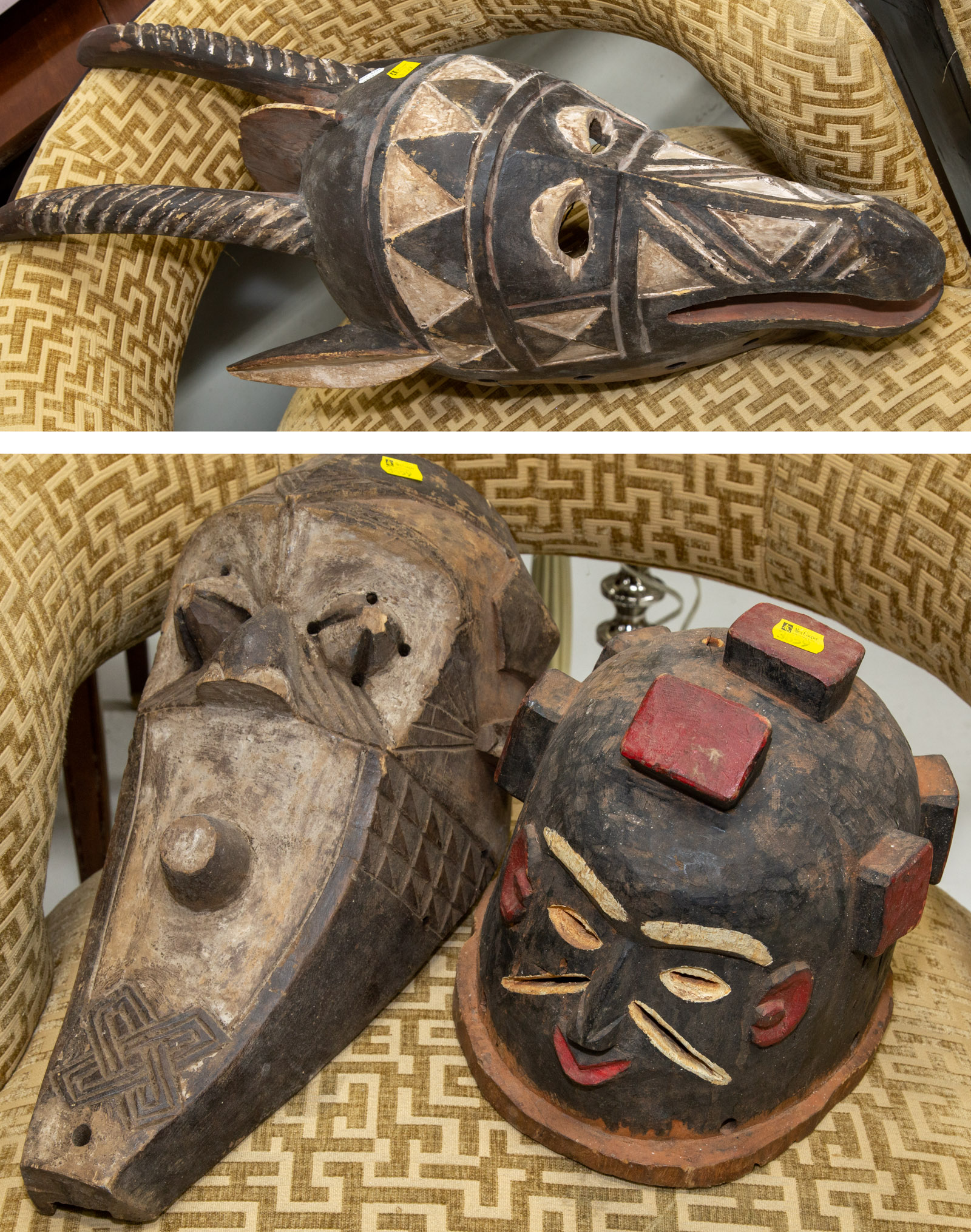 THREE CARVED WOOD AFRICAN MASKS