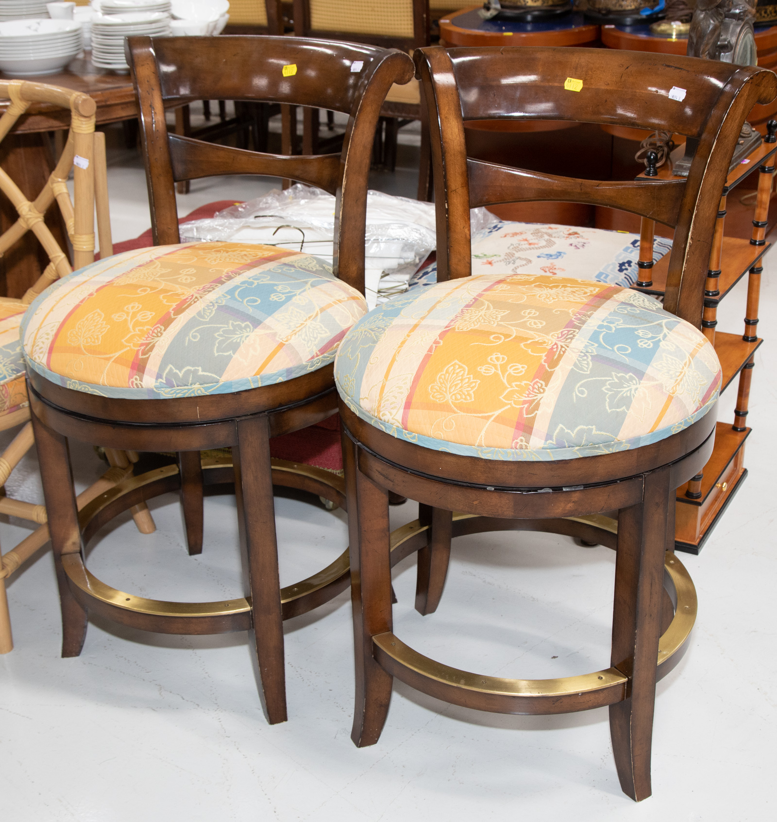 A PAIR OF MODERN SWIVEL BAR STOOLS .