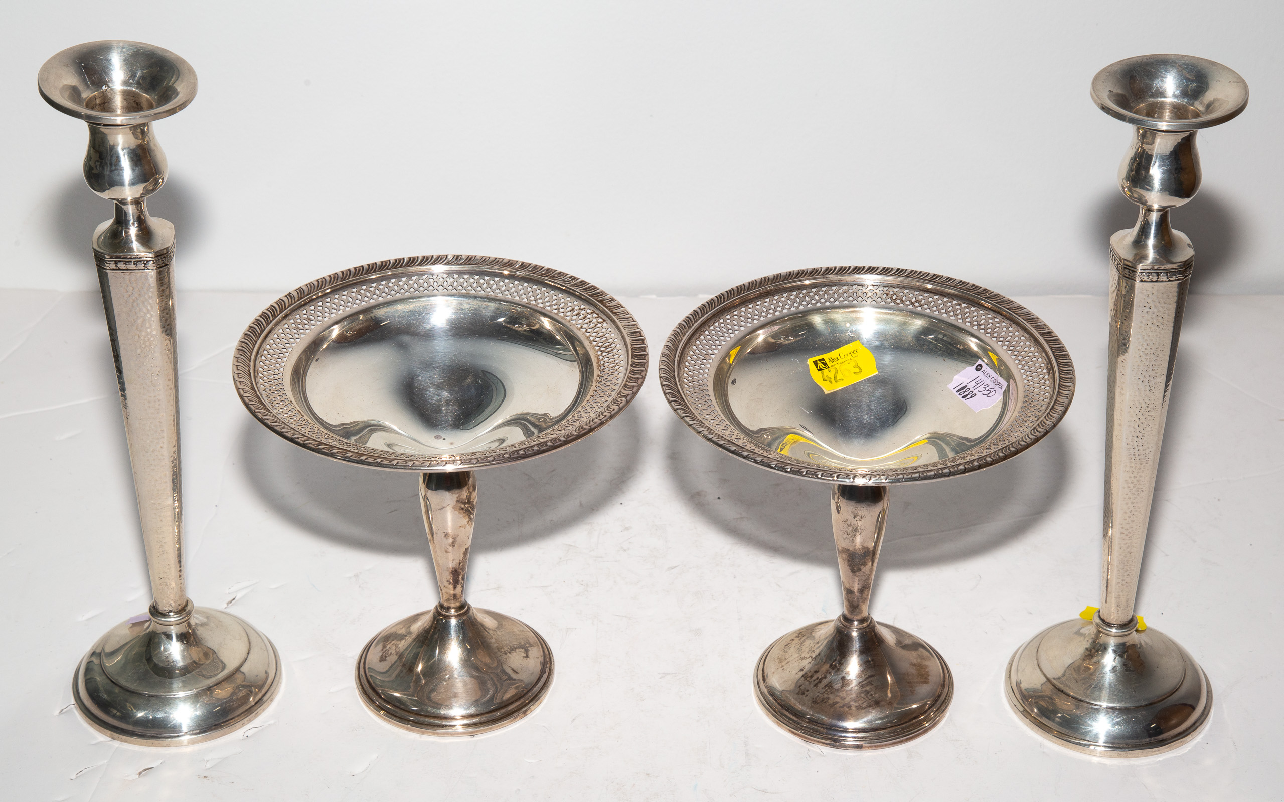 A PAIR OF WEIGHTED STERLING CANDLESTICKS