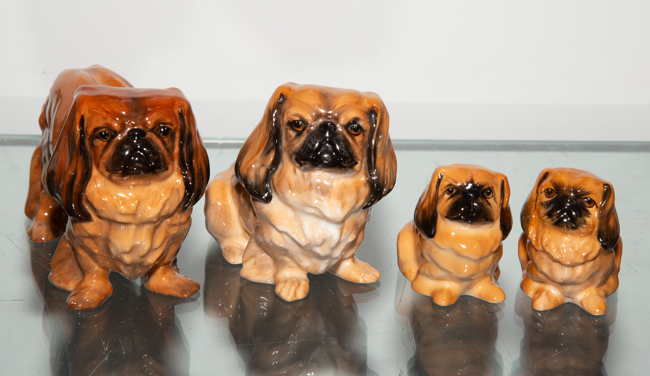 FOUR ROYAL DOULTON DOG FIGURES .