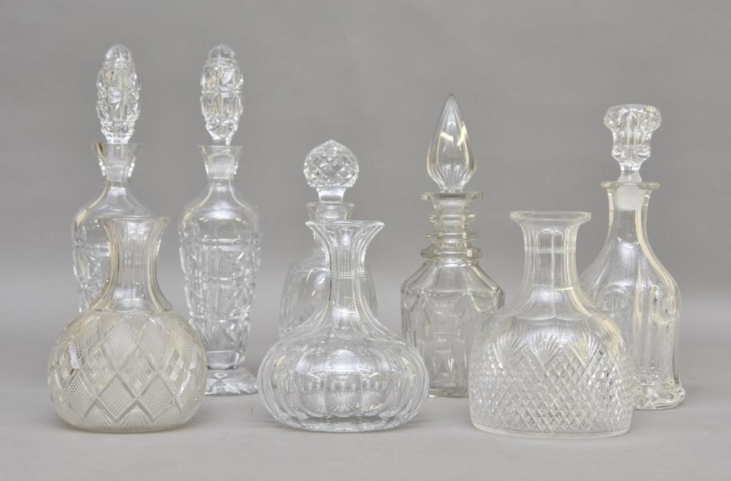 Five crystal glass decanters, tallest