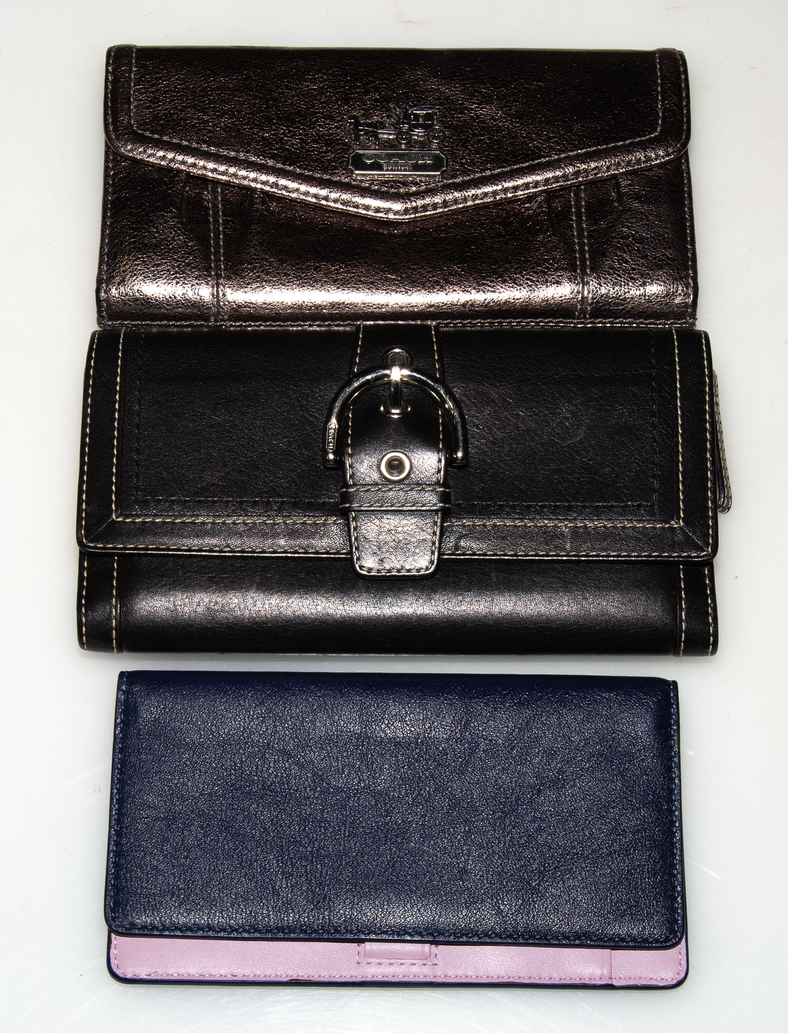 TWO COACH LEATHER WALLETS & A CHECKBOOK