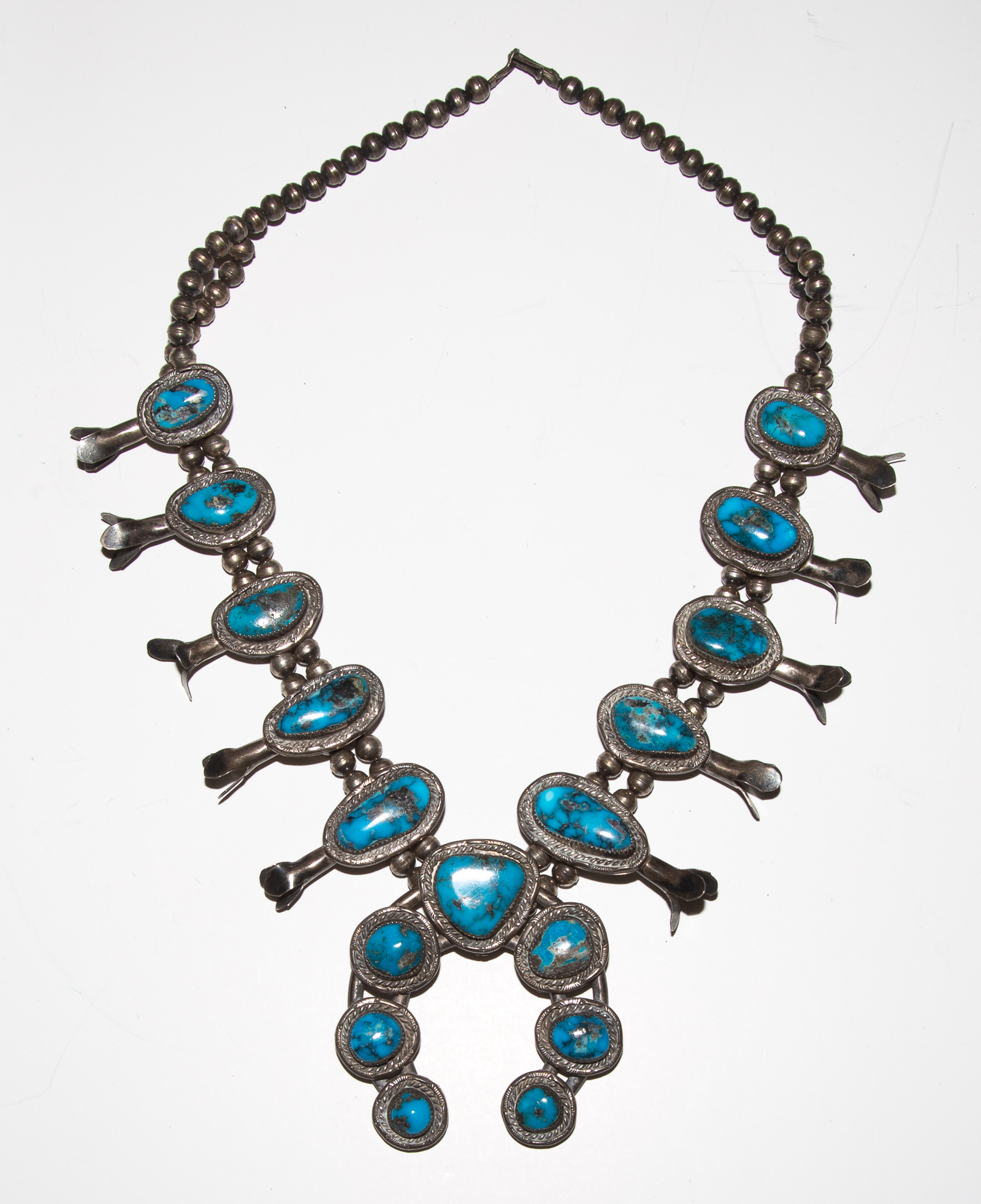 A BOLD TURQUOISE SQUASH BLOSSOM NECKLACE