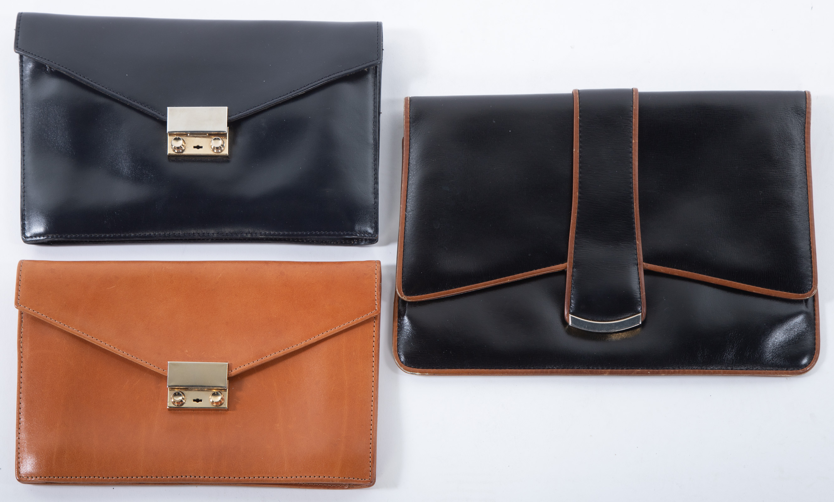 THREE LEATHER ENVELOPE CLUTCHES 33733a