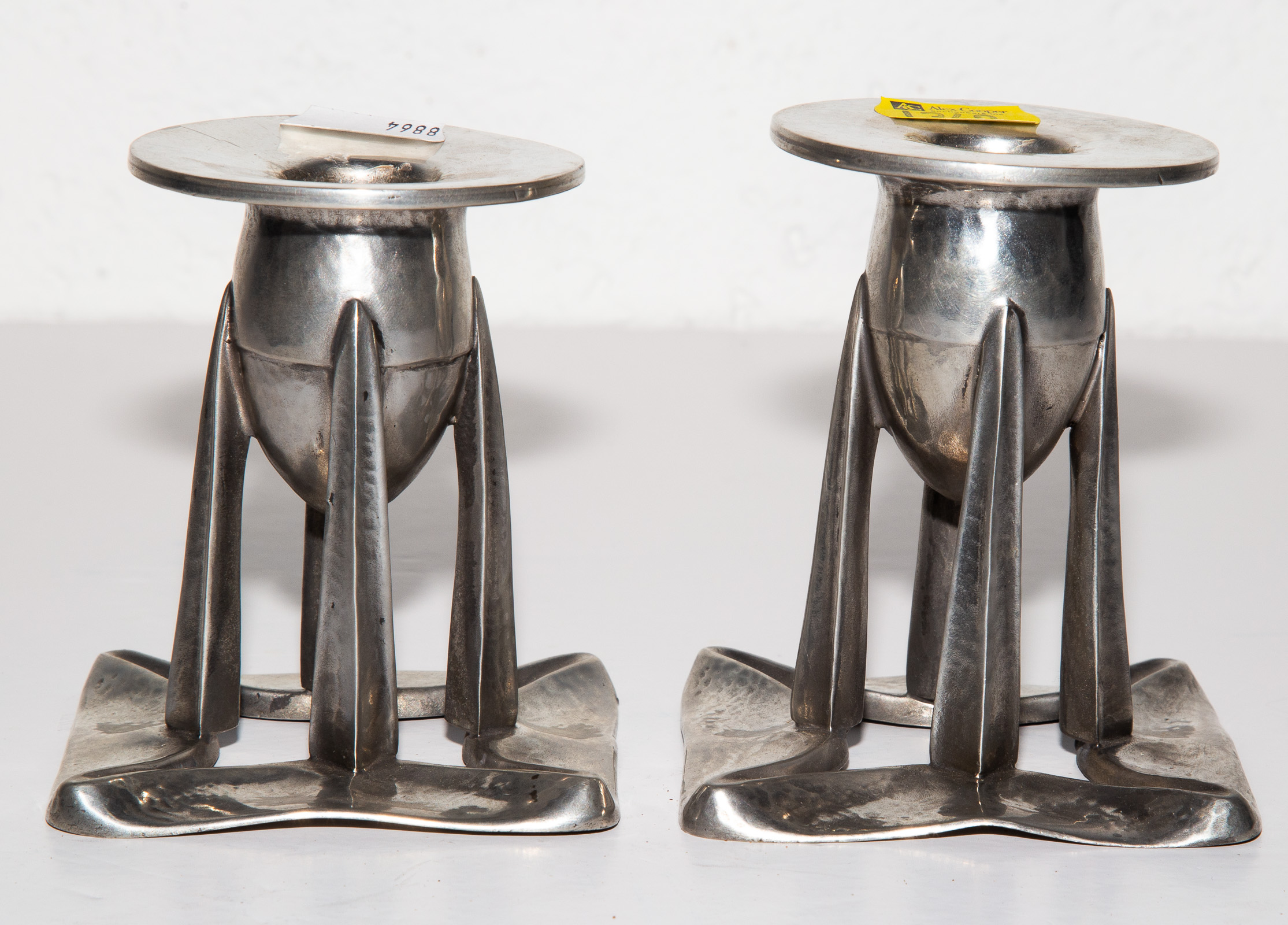 A PAIR OF ART NOUVEAU PEWTER CANDLESTICKS