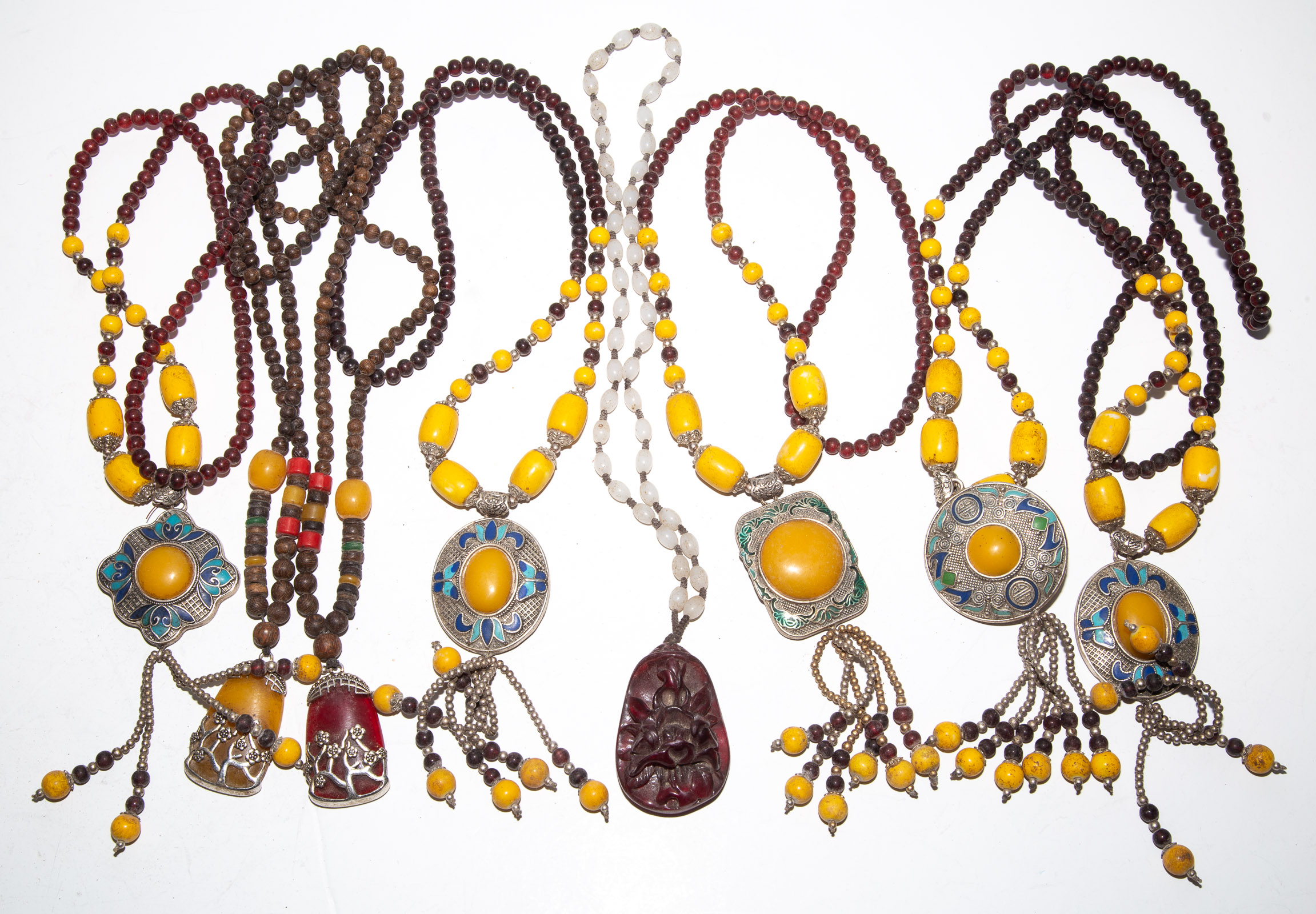 A GROUP OF ASIAN STYLE NECKLACES .