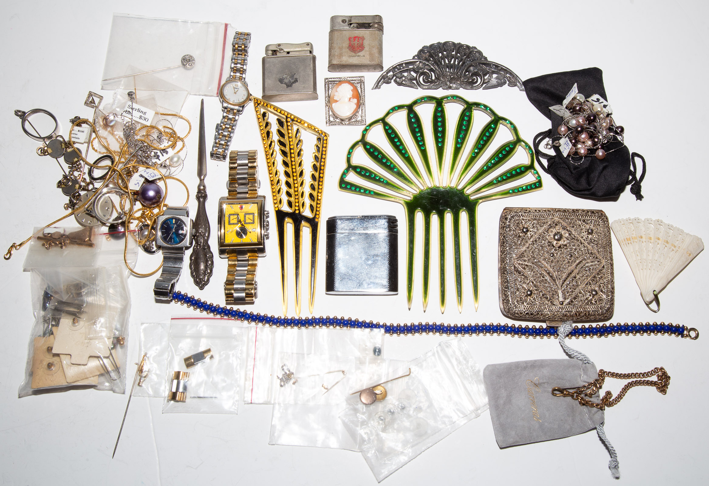 A BAG OF VINTAGE COSTUME JEWELRY