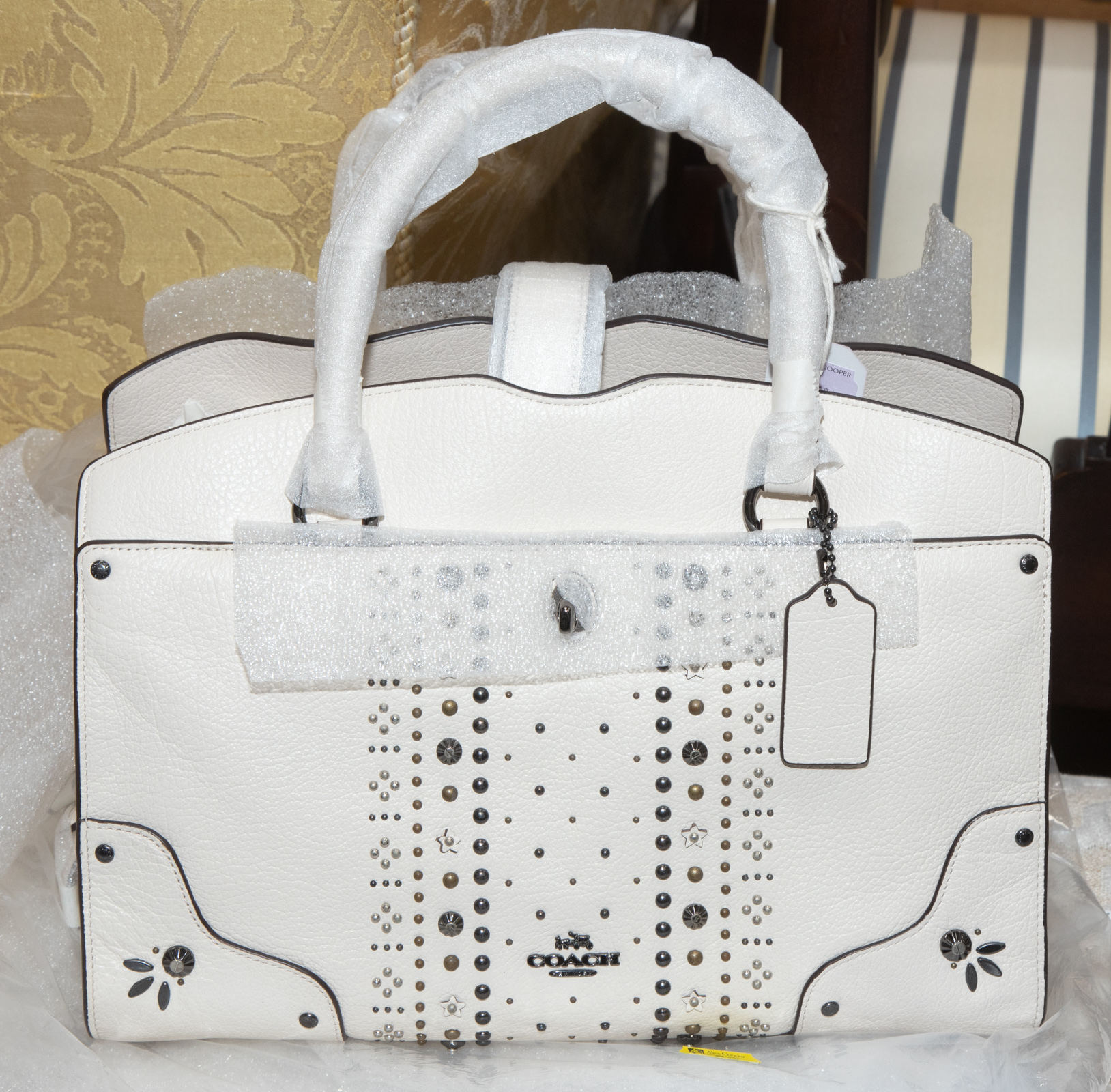 A COACH HANDBAG NWT A cream leather