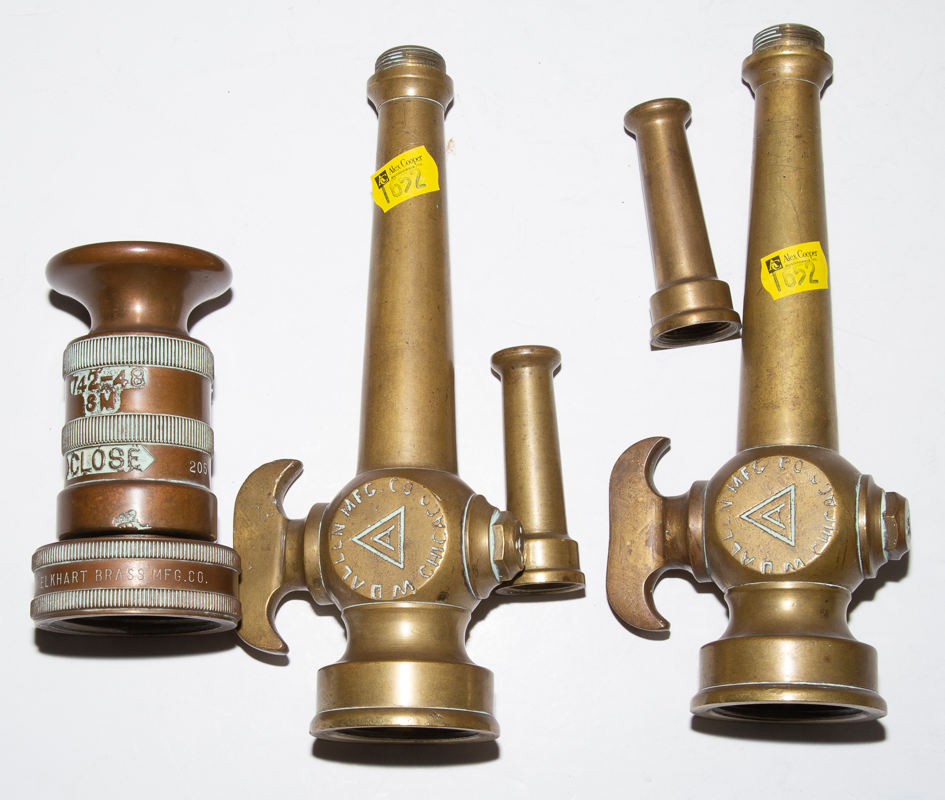 FIVE VINTAGE BRASS NOZZLES .