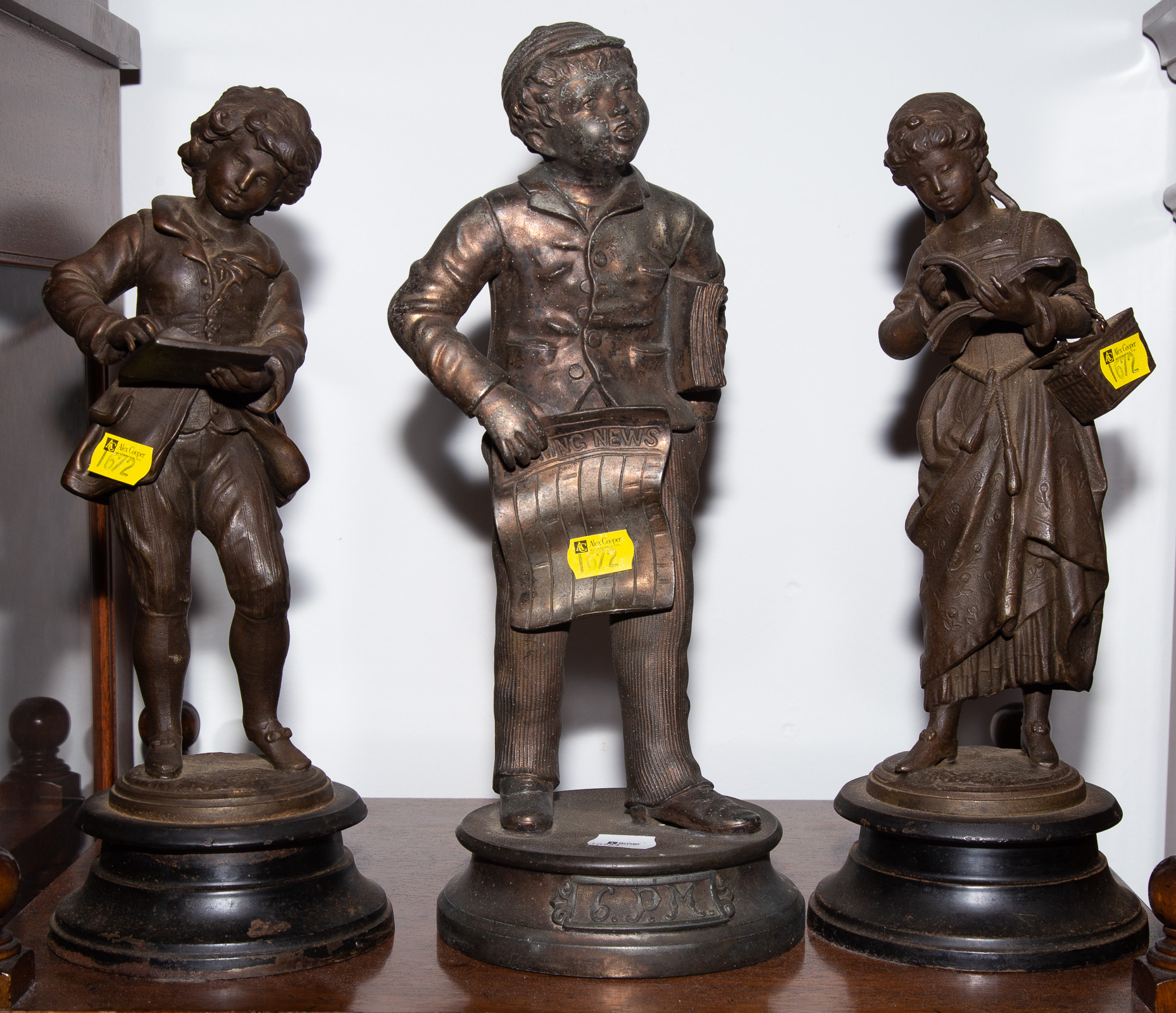 THREE PATINATED METAL FIGURES OF