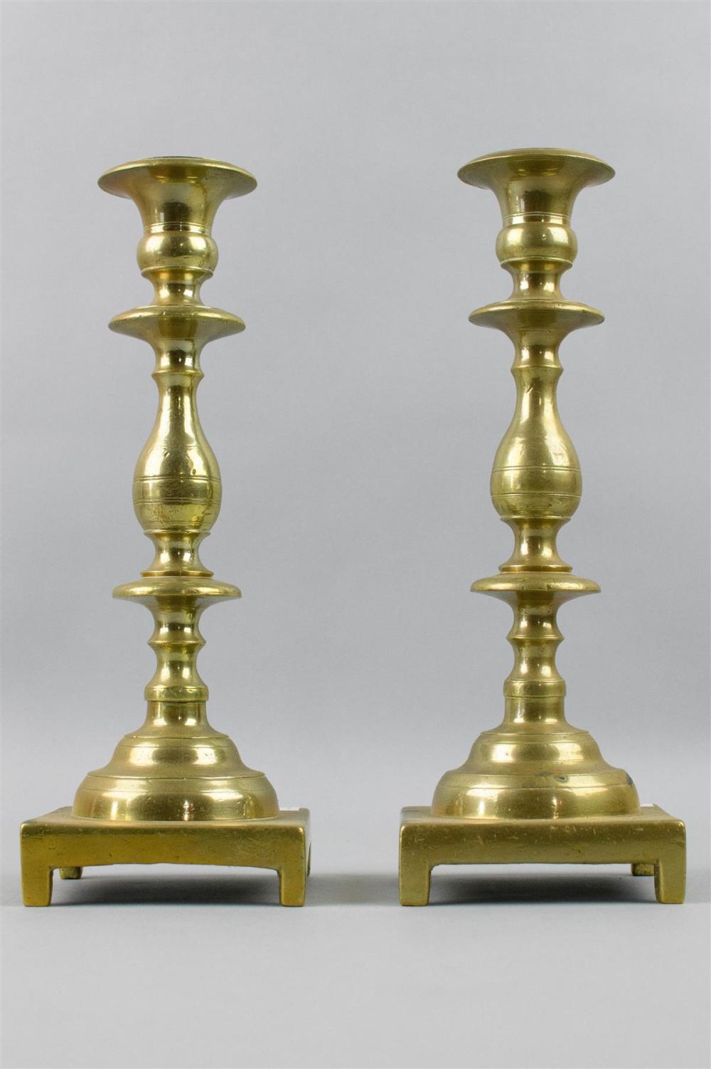 PAIR OF GEORGIAN STYLE BRASS CANDLESTICKSPAIR