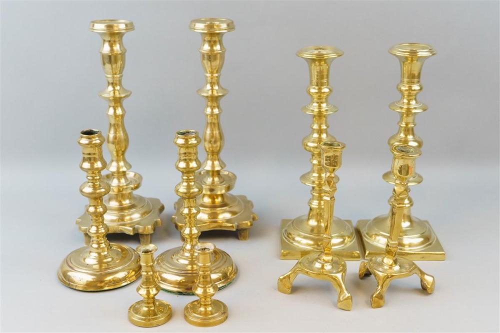 GROUP OF FOUR BRASS CANDLESTICKSGROUP