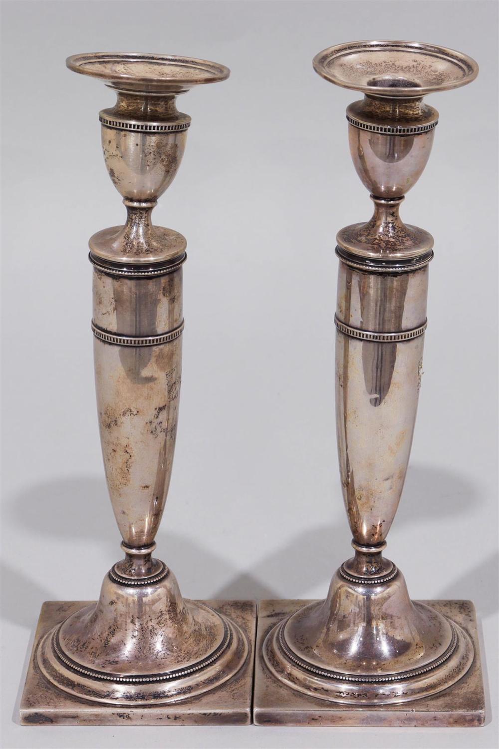 PAIR OF WEIGHTED SILVER CANDLESTICKSPAIR