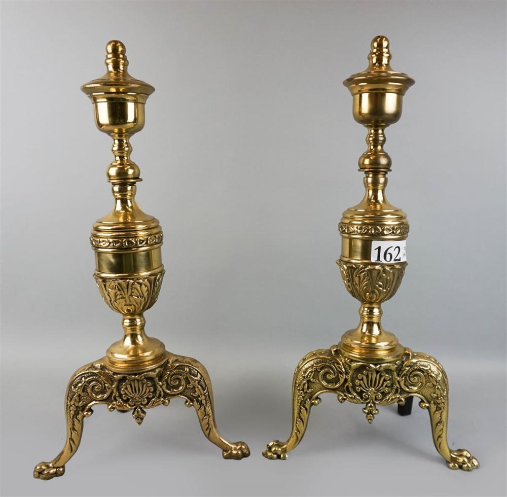 PAIR OF BRASS ANDIRONS WITH SHELL