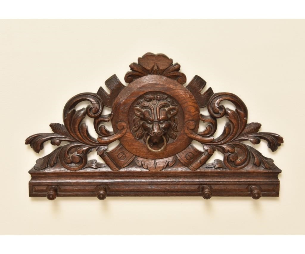 English carved oak coat rack with