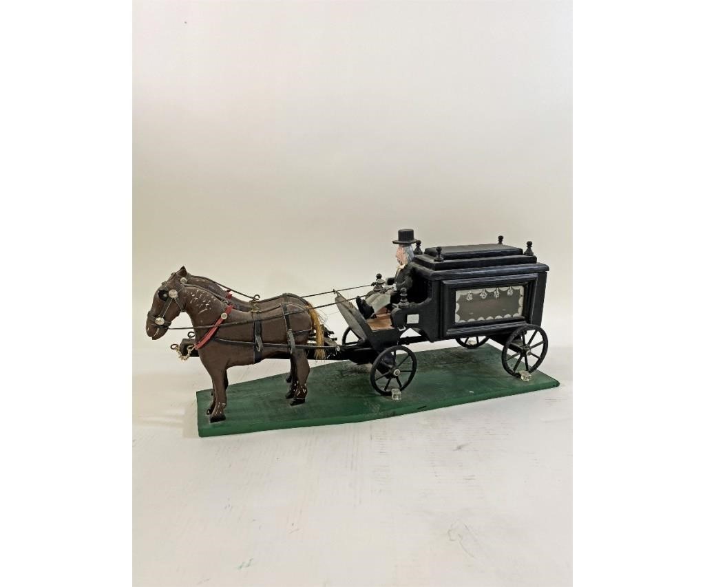 Folk Art carved horses and hearse,