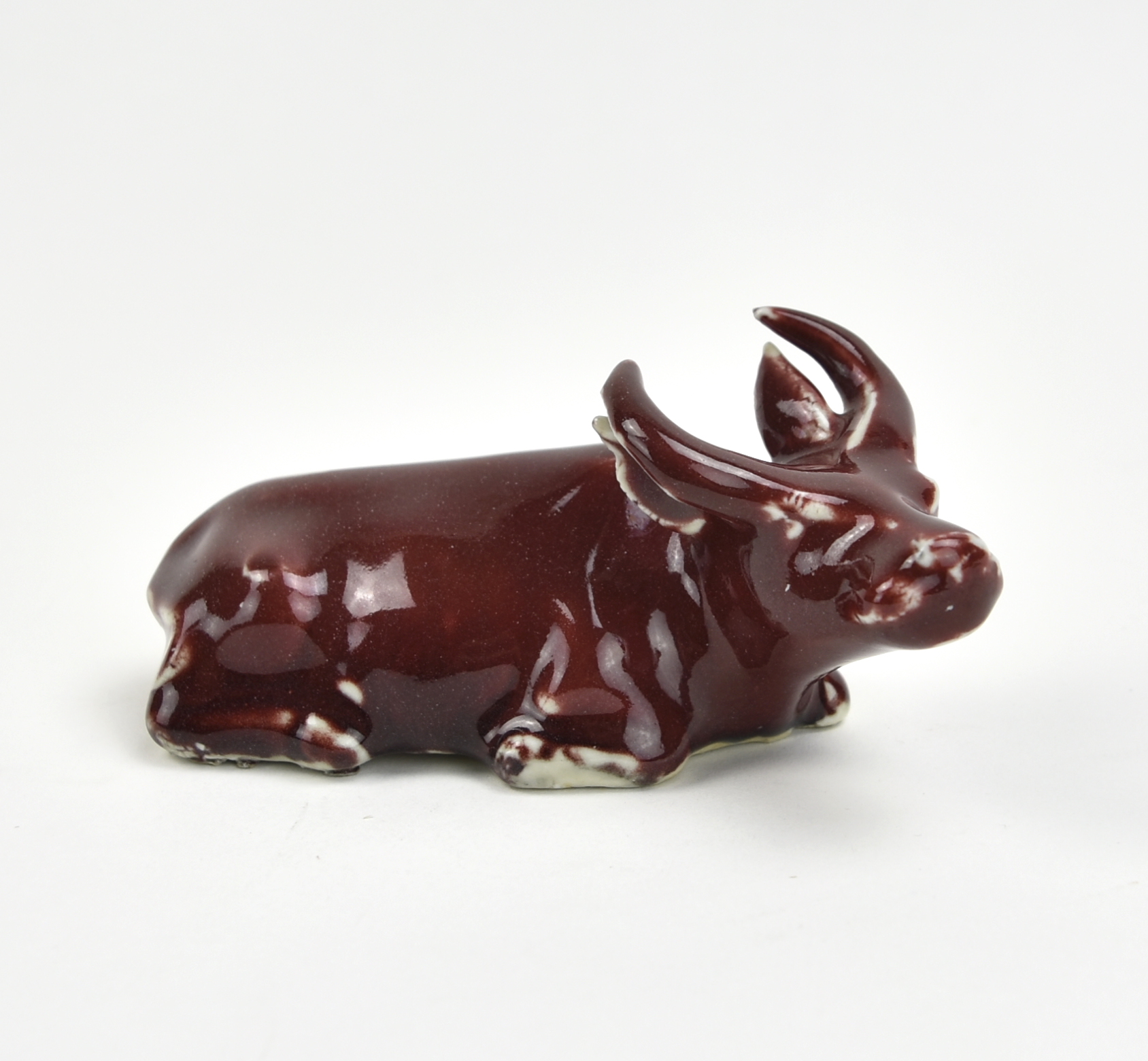 CHINESE RED GLAZED CATTLE FIGURE