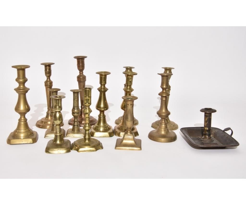 Two pair of Victorian brass candlesticks;