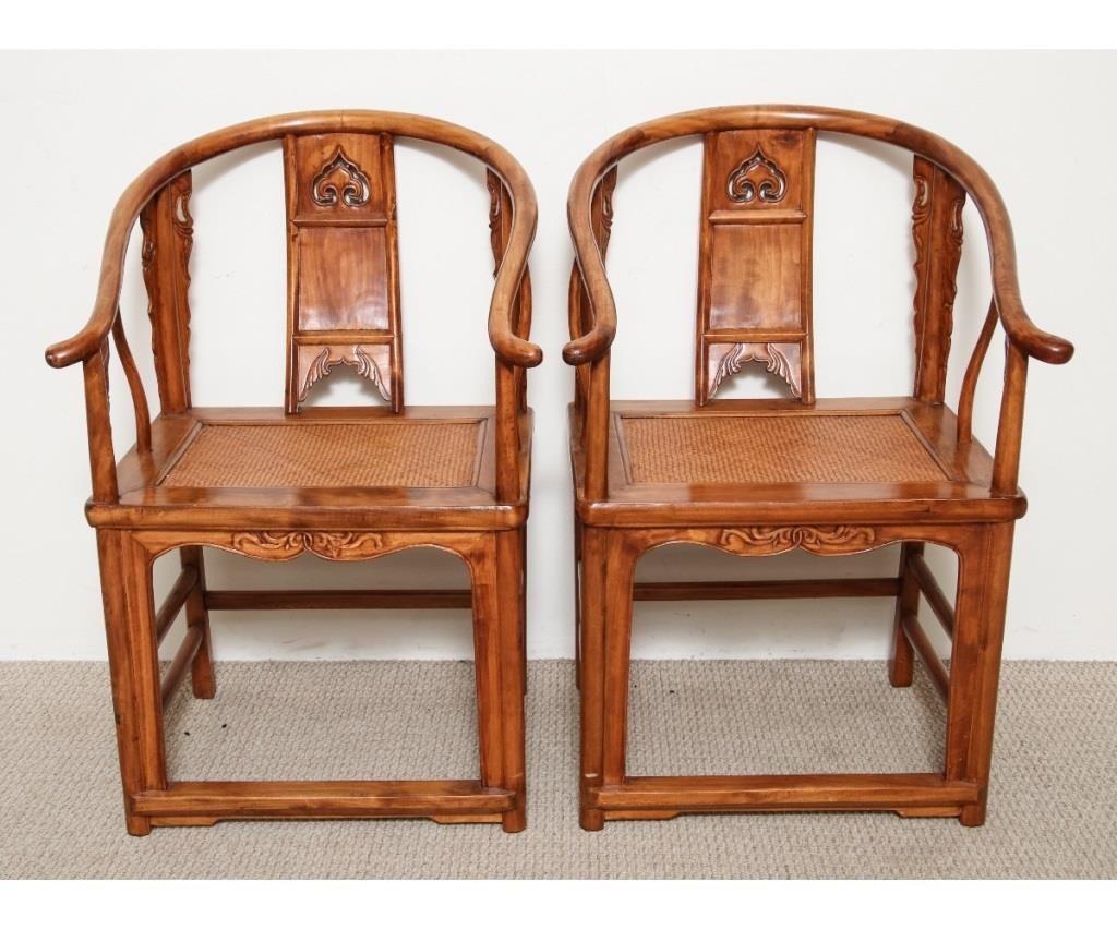 Pair of Chinese hardwood open armchairs