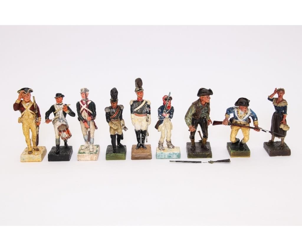 Nine plaster soldiers including