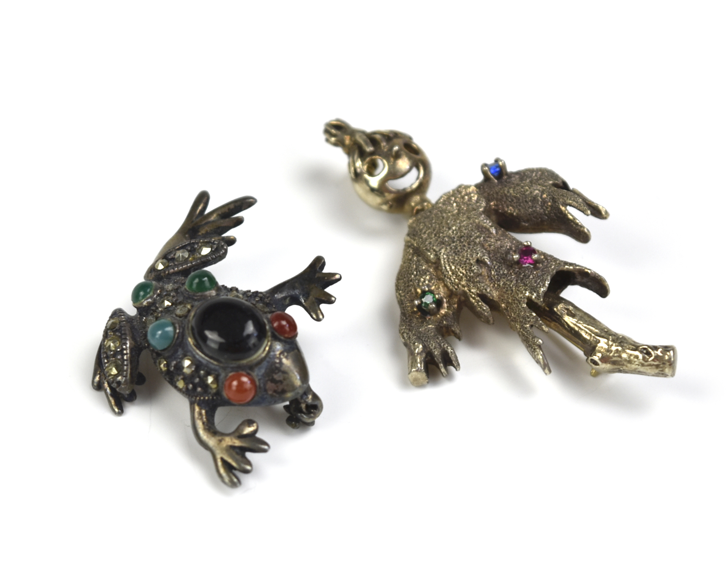 TWO SILVER BROOCHES, FROG AND STRAWMAN