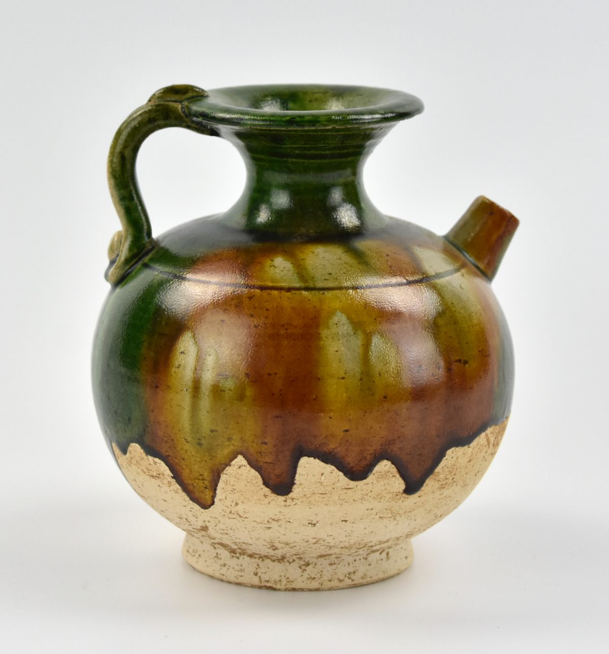 A CHINESE SANCAI GLAZED WINE POT  339728