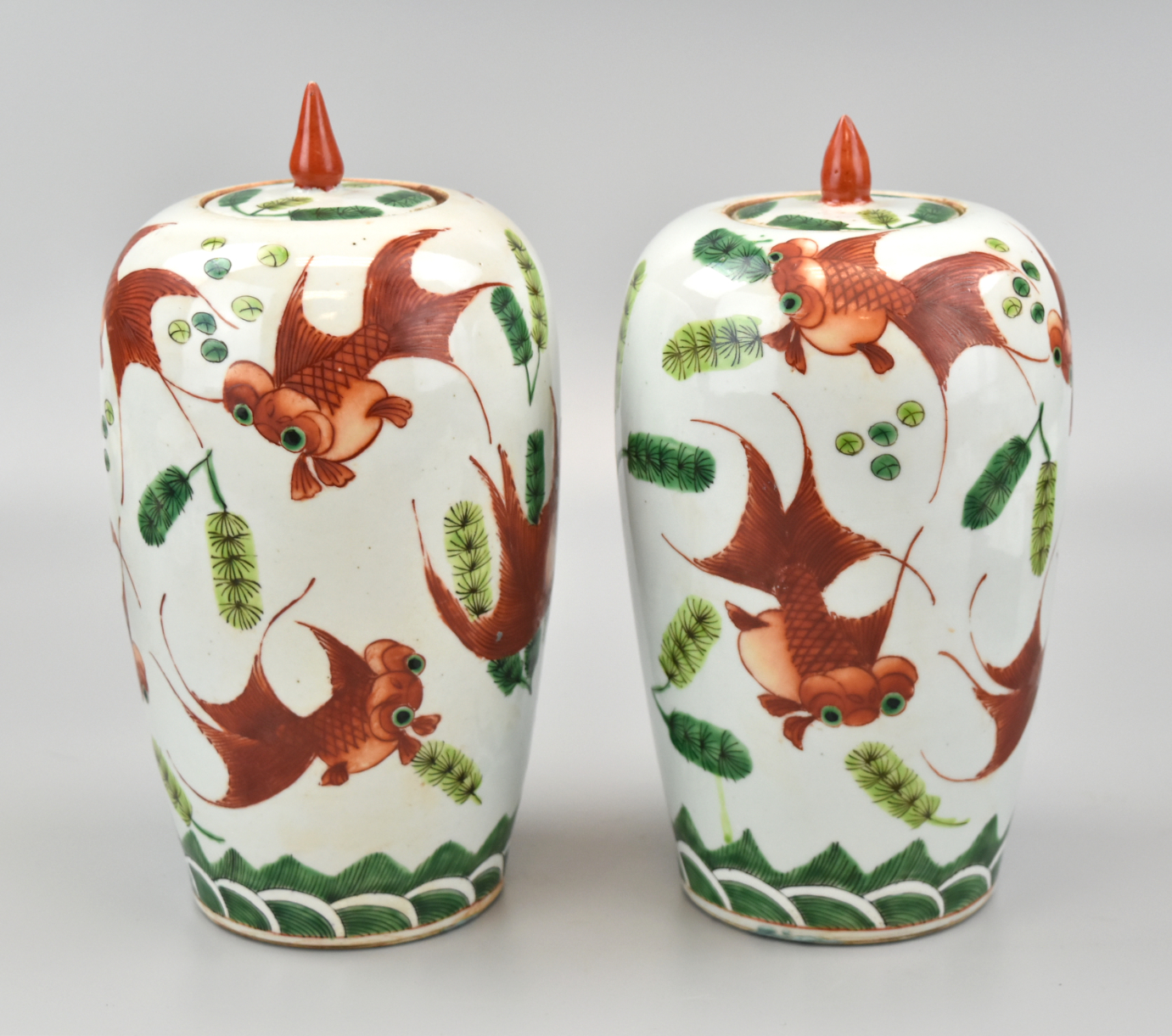 PAIR OF IRON RED GOLDFISH JARS