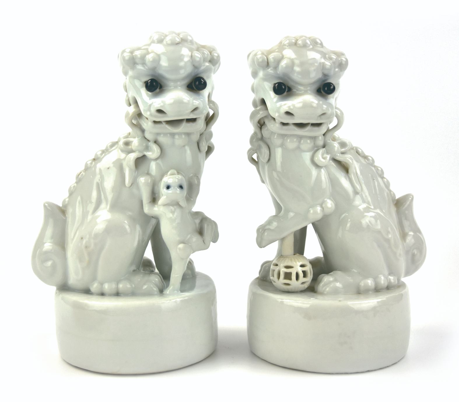 PAIR OF CHINESE WHITE GLAZED LION,