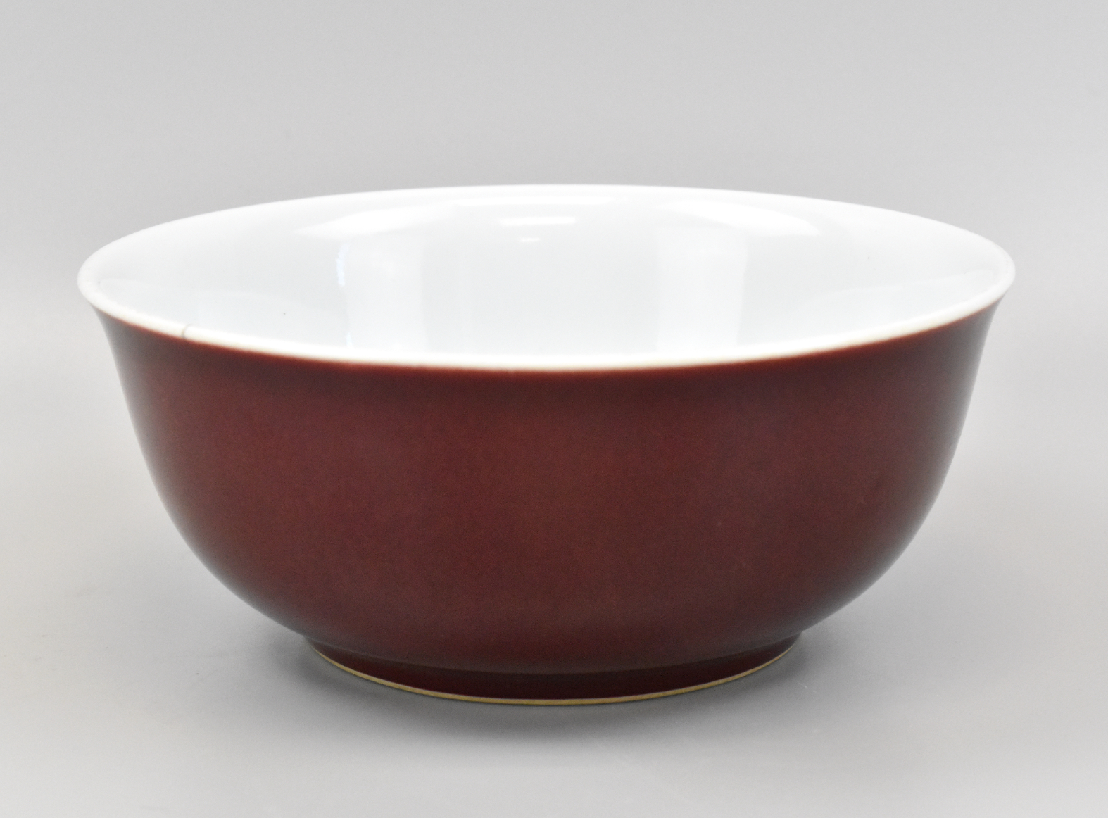 A CHINESE SANG DE BOEUF BOWL W/