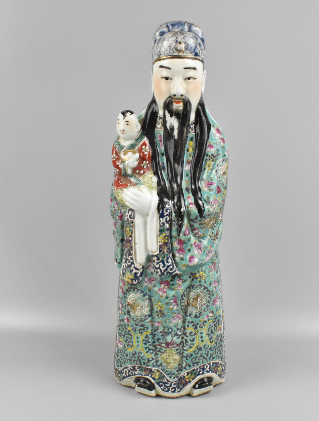 CHINESE FAMILLE ROSE FIGURE HOLDING