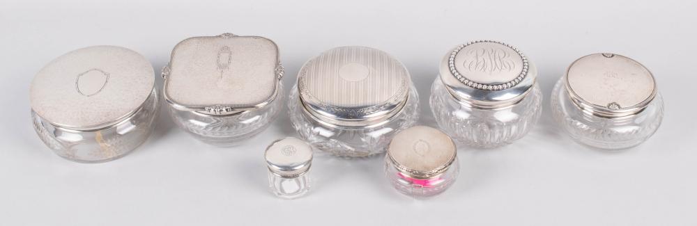 GROUP OF SEVEN SILVER-TOPPED POWDER