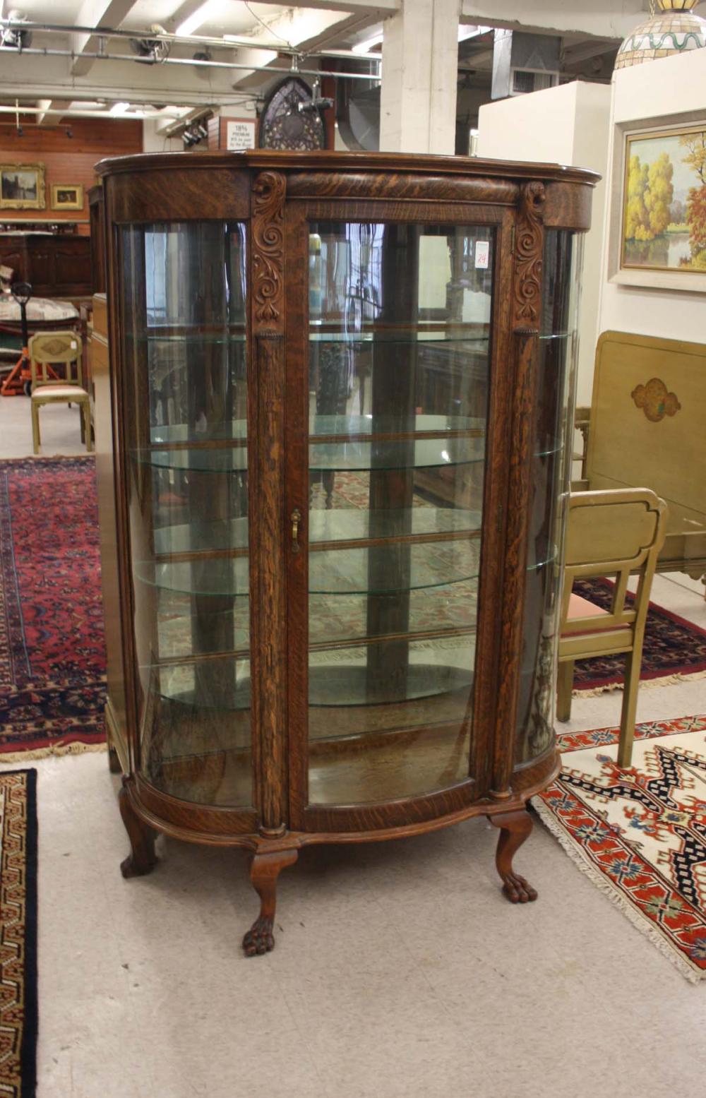 ANTIQUE CARVED OAK AND CURVED GLASS