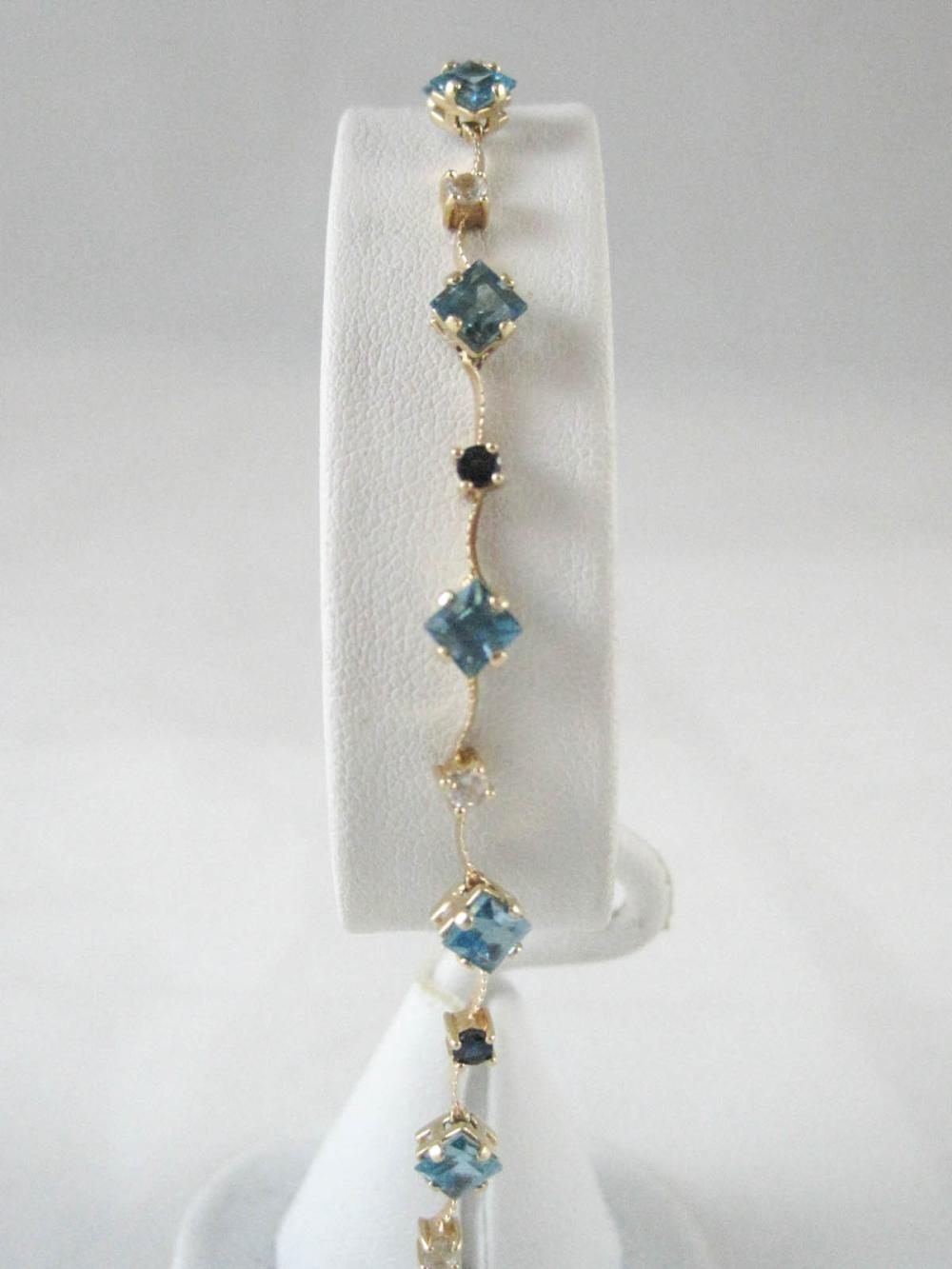 BLUE TOPAZ AND FOURTEEN KARAT GOLD 33e024