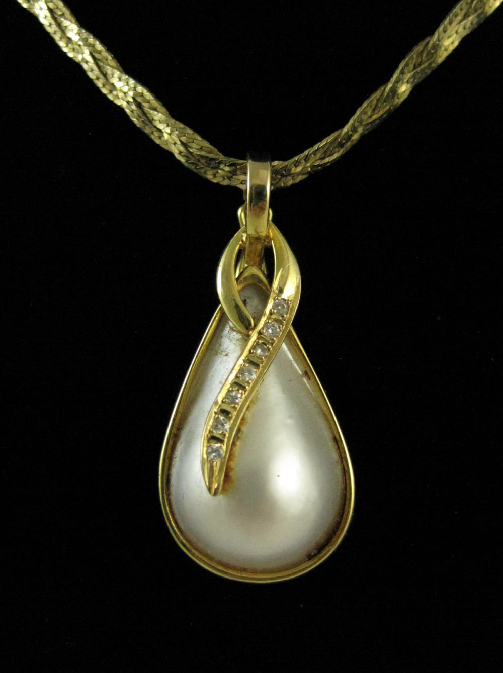 MABE PEARL AND FOURTEEN KARAT GOLD