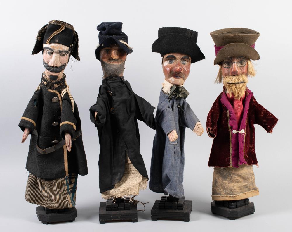 FOUR PUPPETS WITH CARVED WOOD FACES,