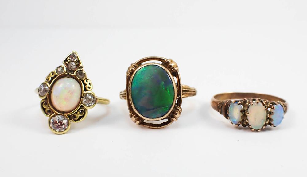THREE OPAL AND YELLOW GOLD RINGS,
