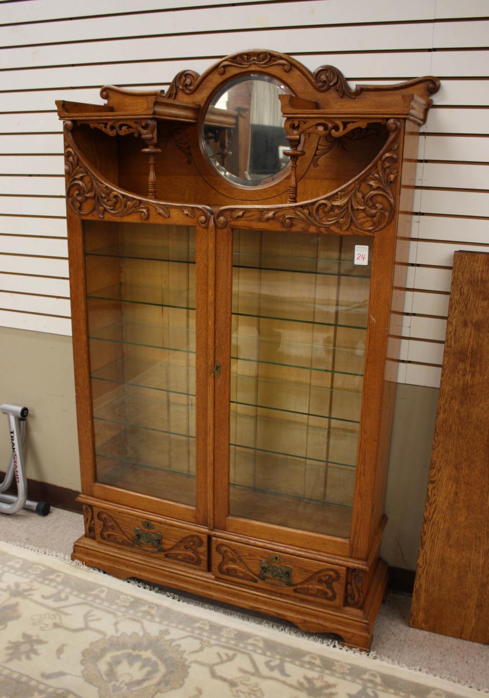 LATE VICTORIAN CARVED OAK CABINET BOOKCASE,